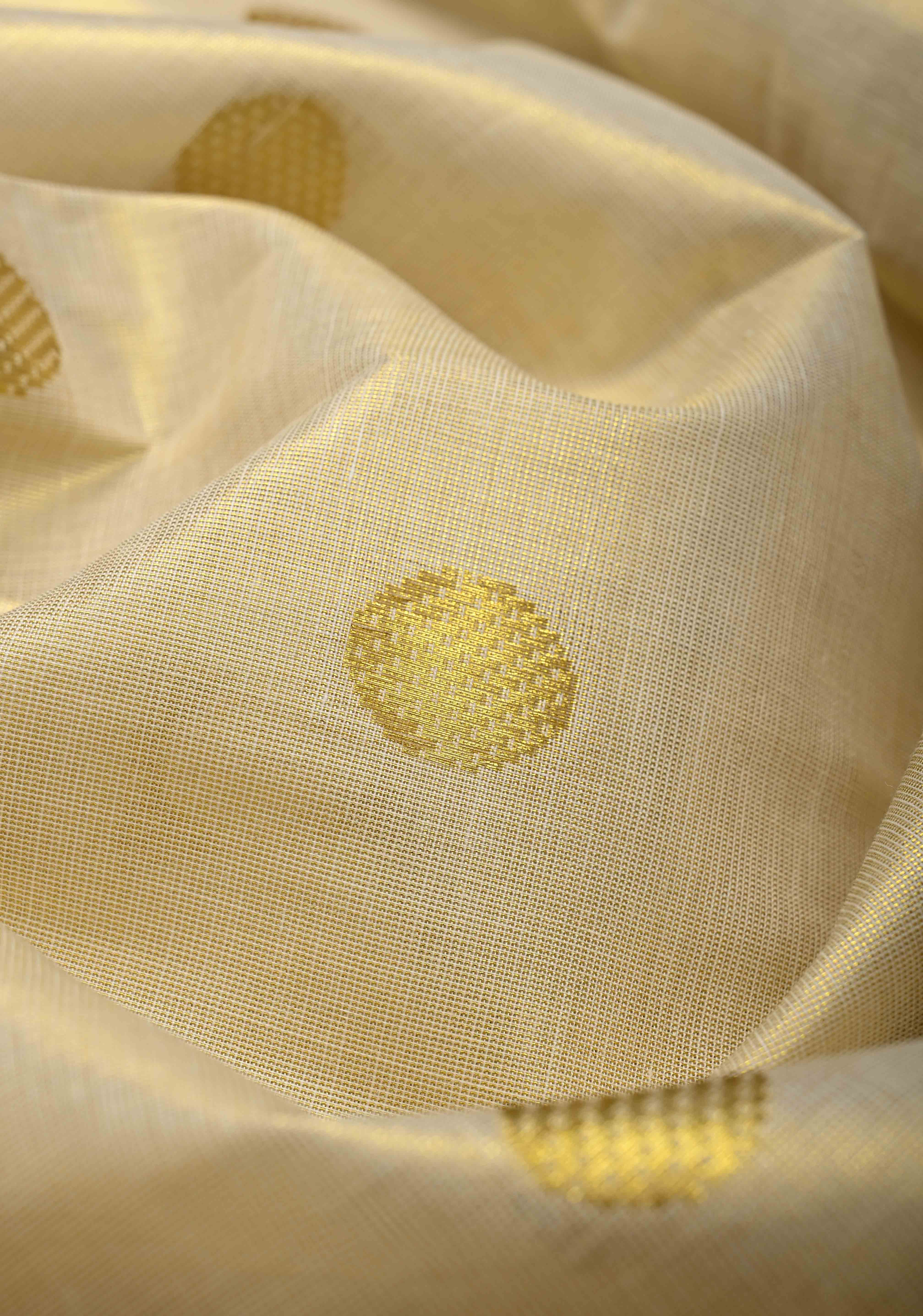 Beige Tissue Cotton Saree with Zari Coin Buttis And Temple Border | Shobitam
