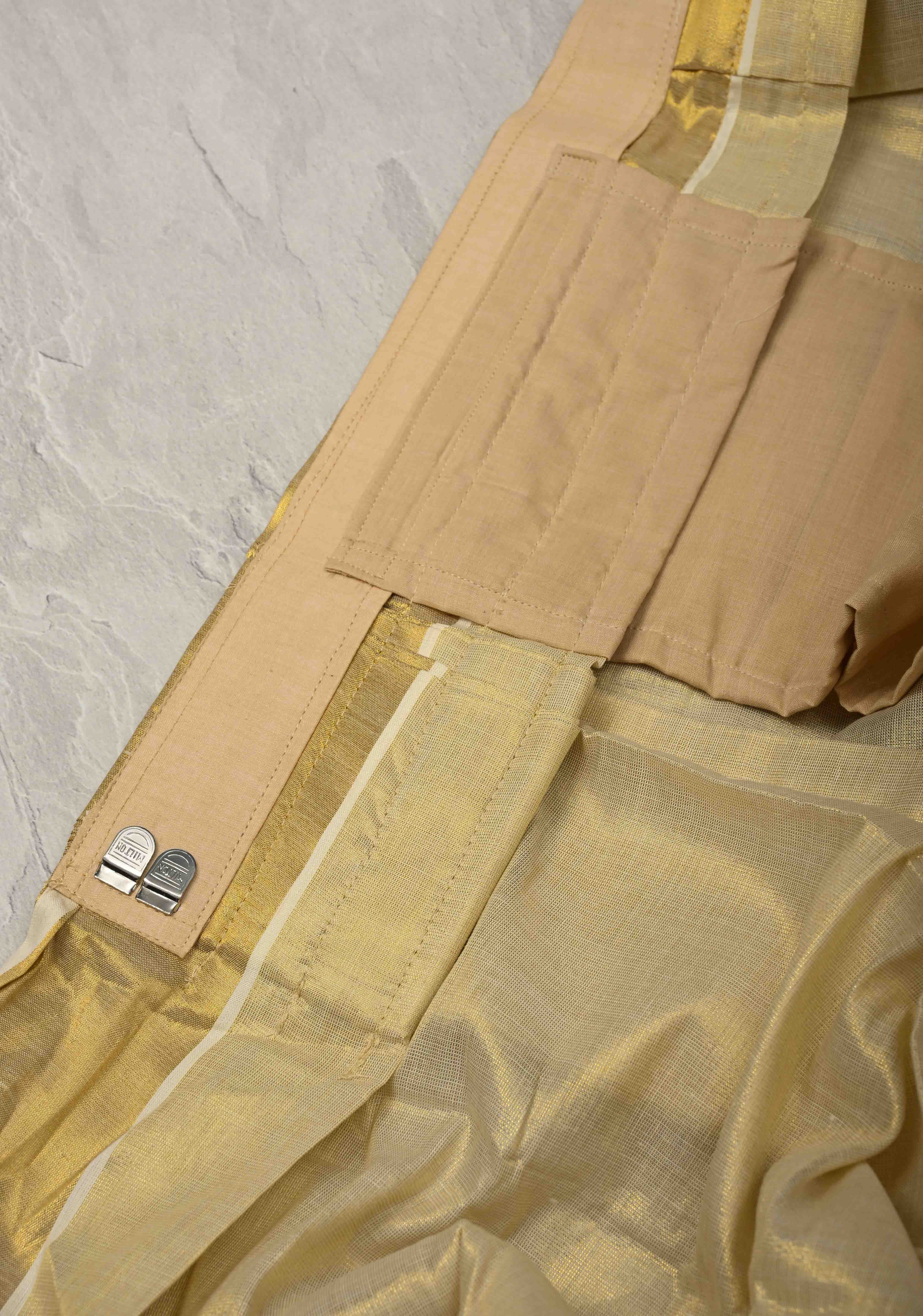 Off White Pre Stitch Adjustable Kerala Kasavu Cotton Tissue Saree with Zari Borders and pocket | Shobitam