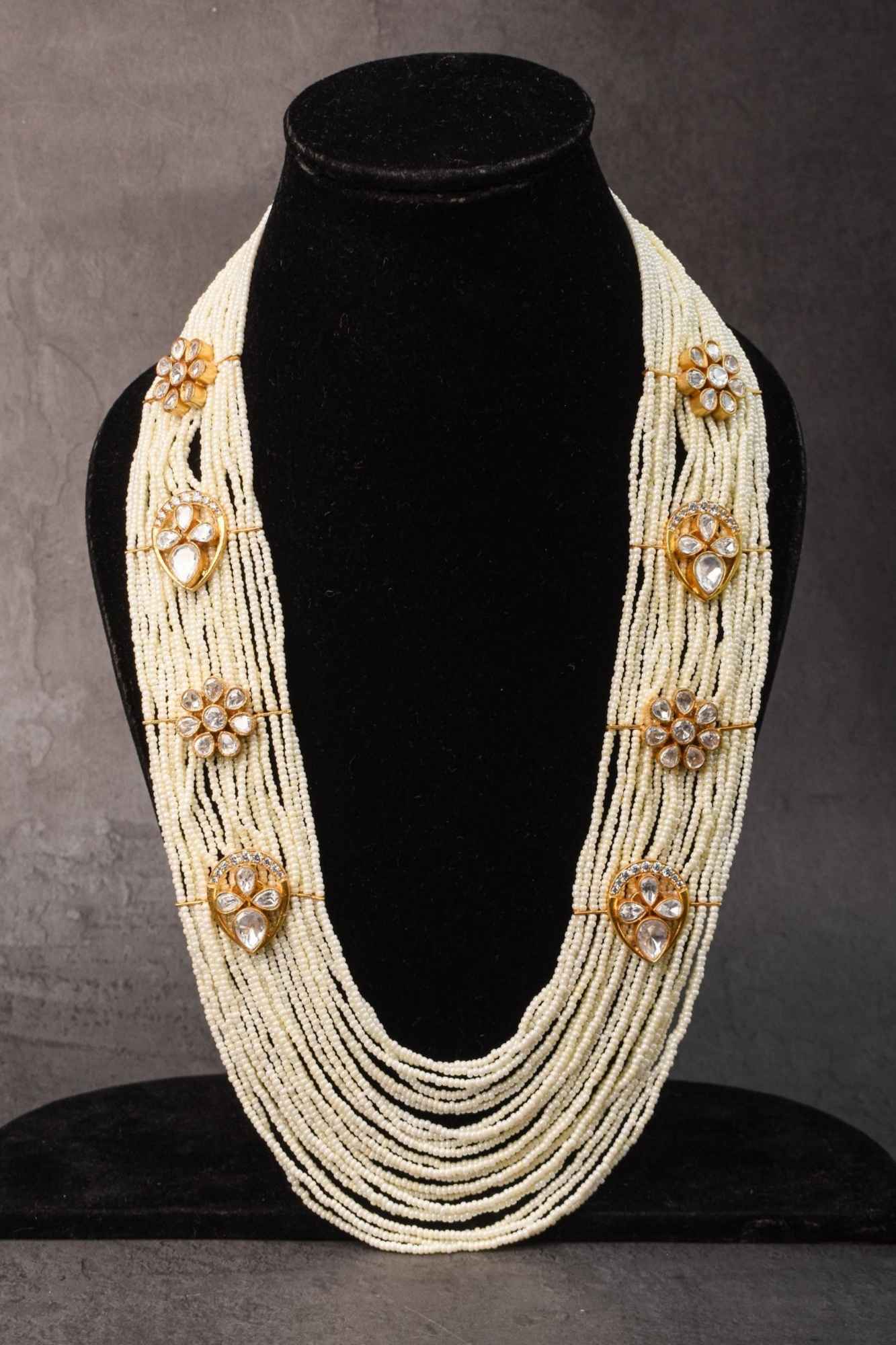 Floral Unit on Multistrand Haar Necklace set in white