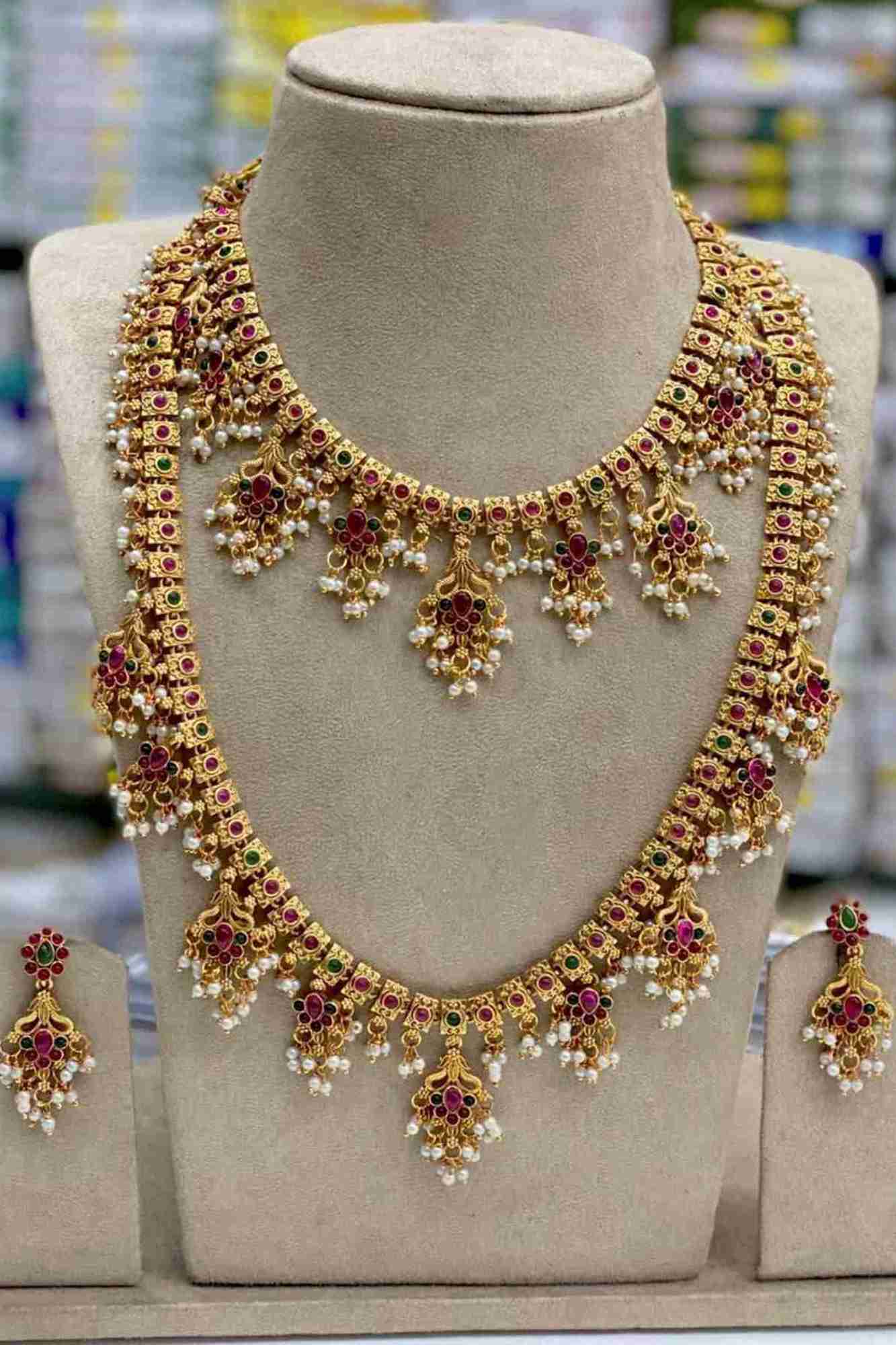 Traditional Gold-Toned Necklace Set with Emerald Accents and Pearl Dangling Drops With Matching Earring