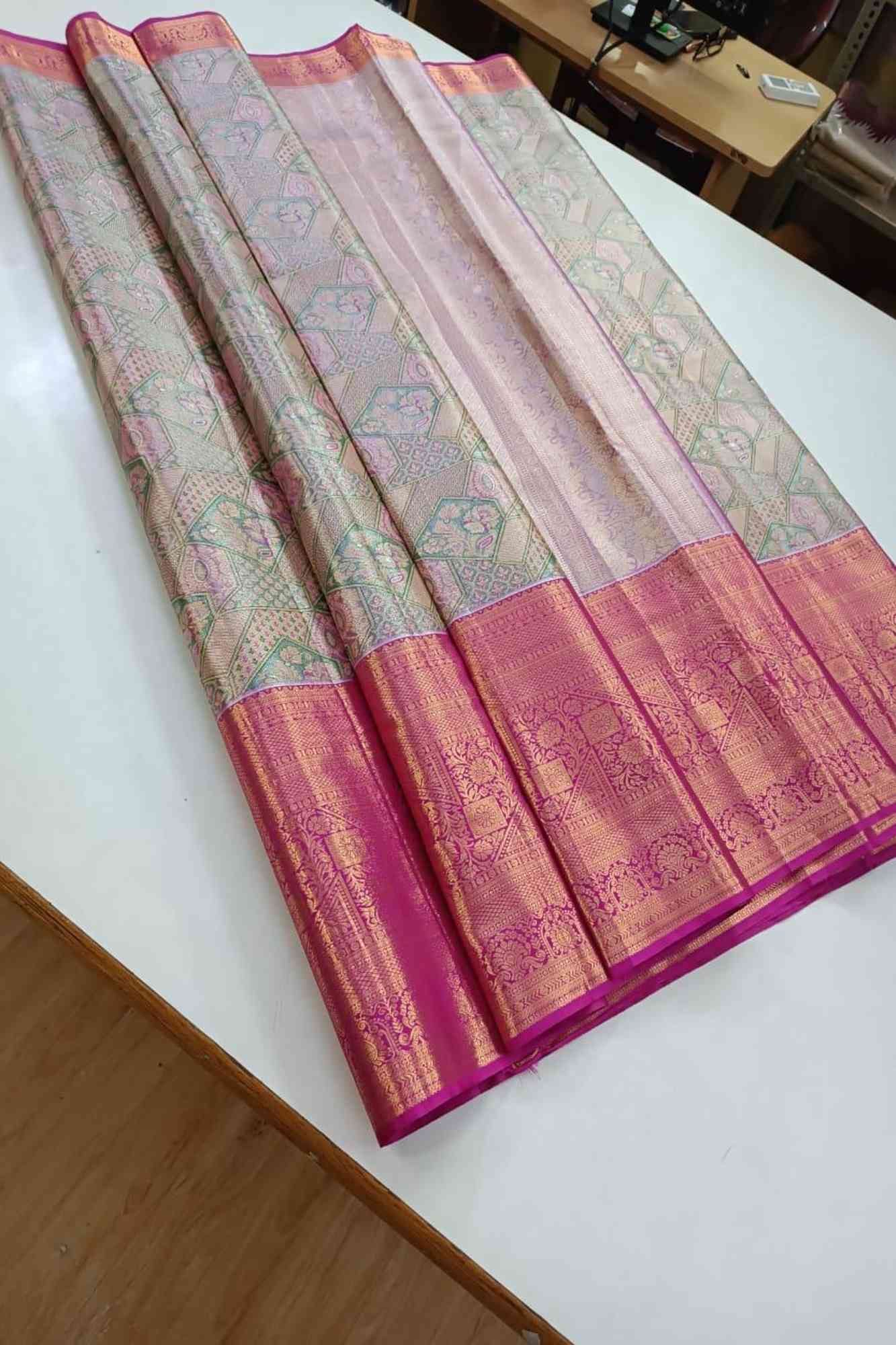 Kanchi Pattu with Intricate Floral Weave & Grand Zari Border Ready To Wear Saree