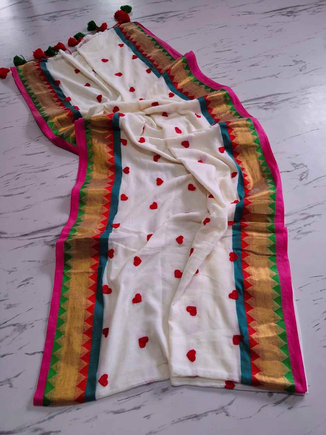 Handcrafted Mulmul Cotton with Geometric Border and Tassel Ready To wear Saree