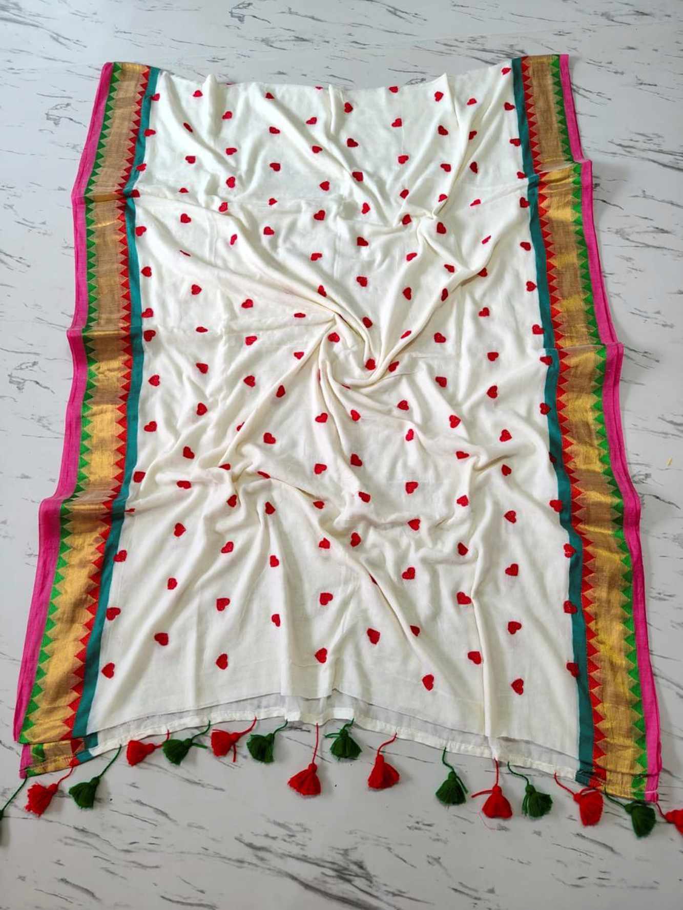 Handcrafted Mulmul Cotton with Geometric Border and Tassel Ready To wear Saree