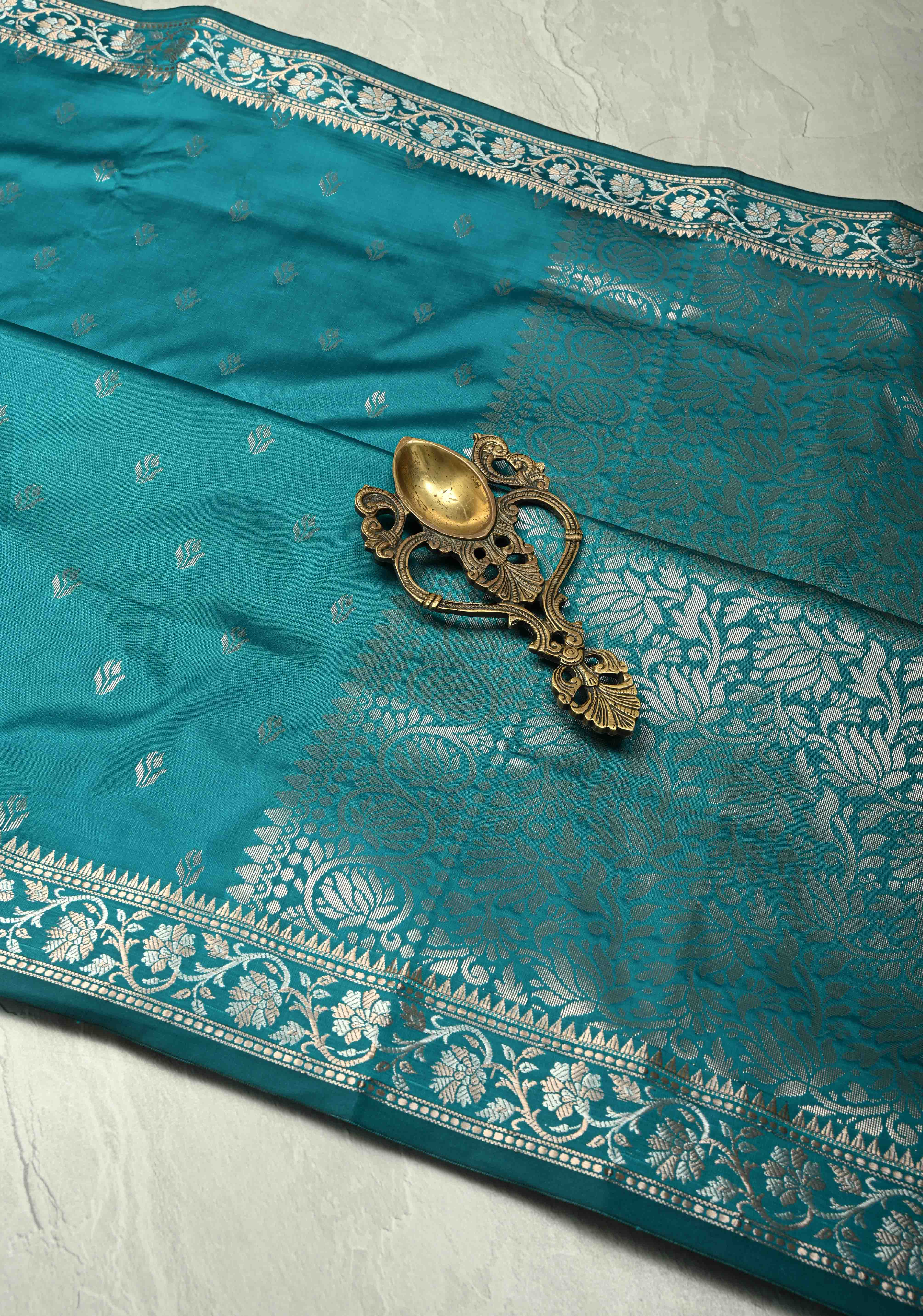 Teal Blue Semi Silk Saree with Floral Buttas and Alfi Zari Border