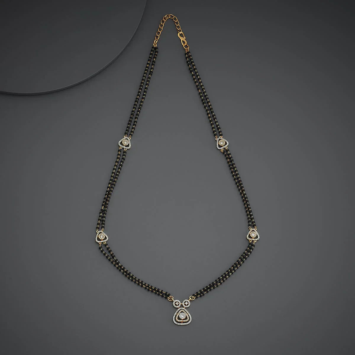 Elegant Double-Strand Black Bead Mangalsutra with Sparkling Zircon Pendants and Accent