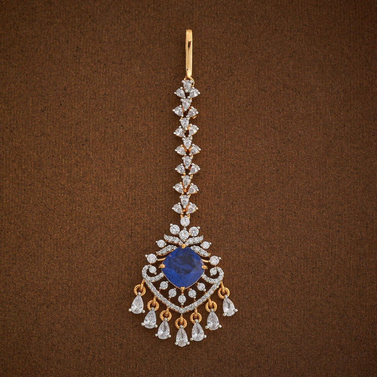 Handcrafted Maang Tikka embellished with synthetic stones in White and Sapphire | SHOBITAM
