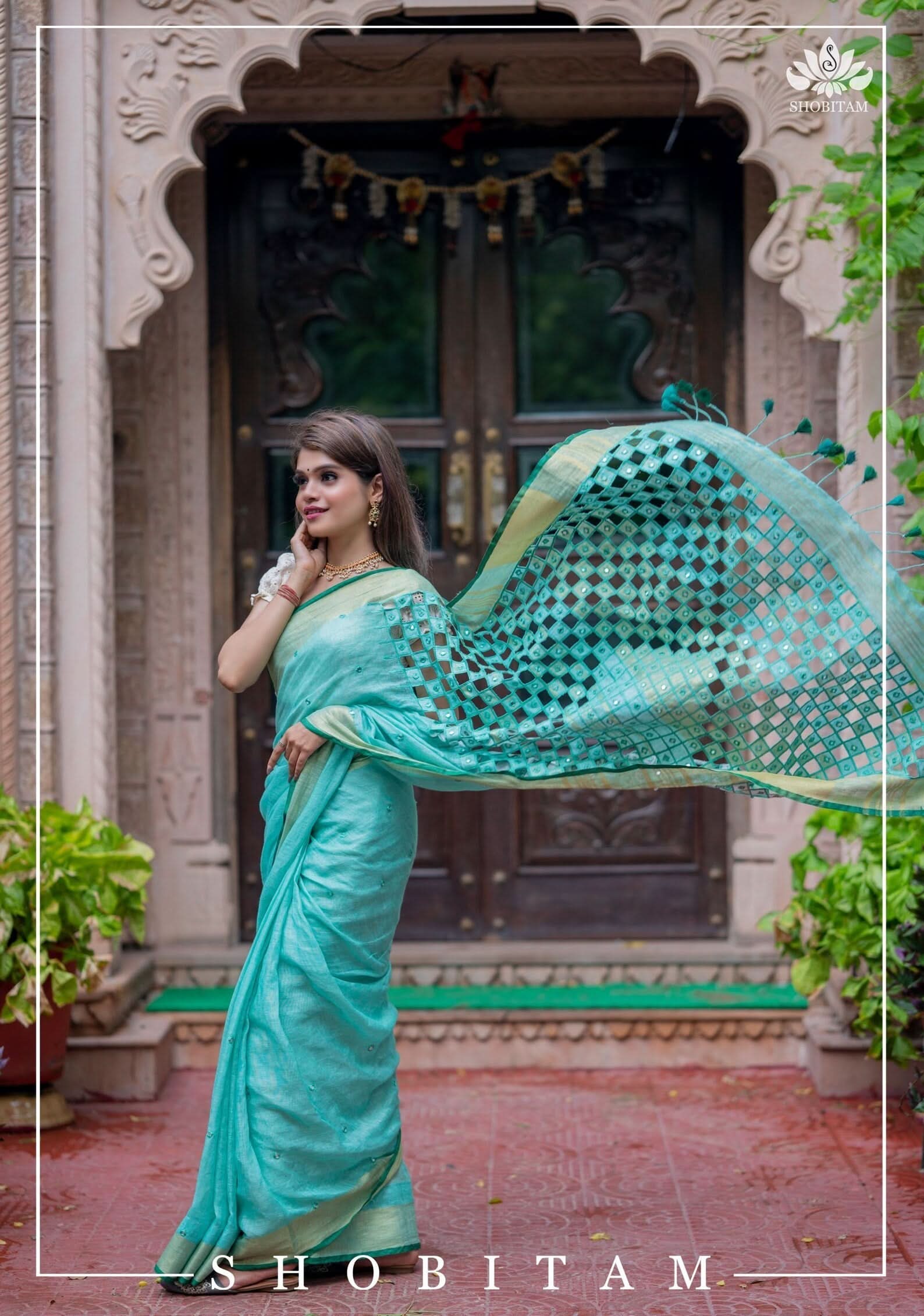 Jaali Pallu - Cutwork and Mirrorwork Saree in Linen by Linen in Teal Color | Shobitam