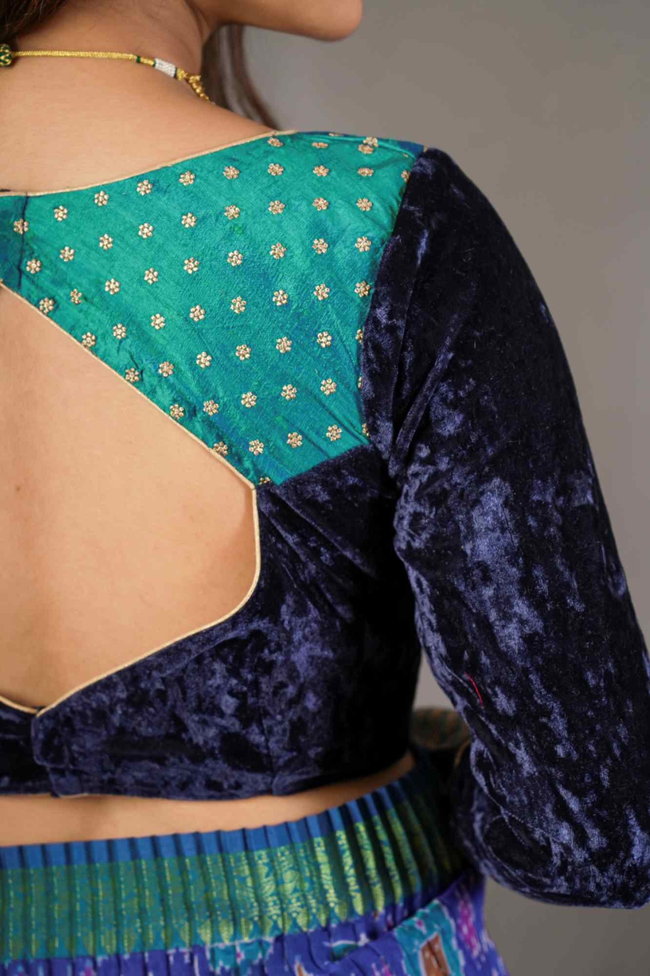 Navy blue crushed velvet V neck blouse with raw silk and brocade detailing