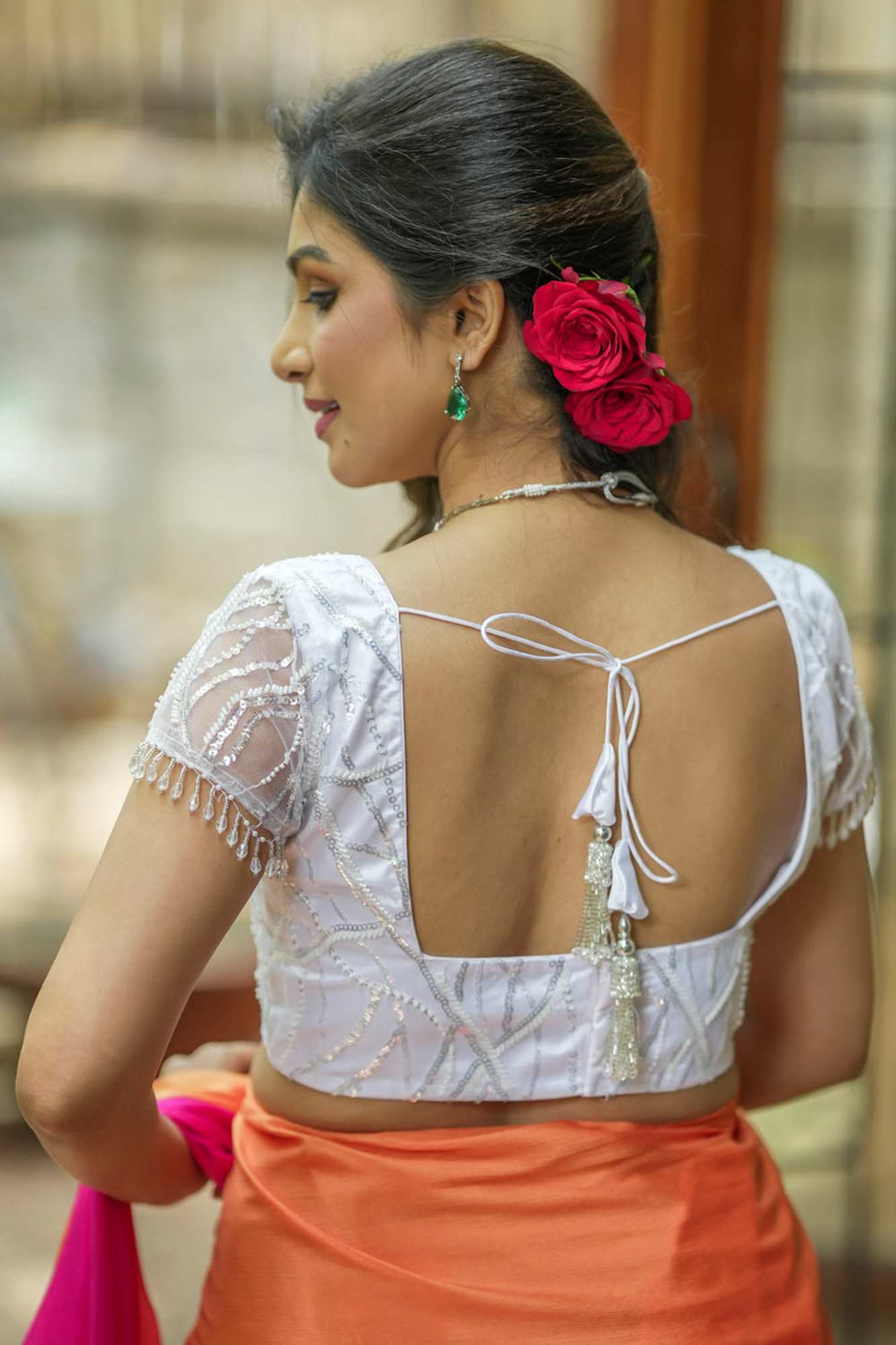 White sequin sweetheart neck blouse with net frills detailing.