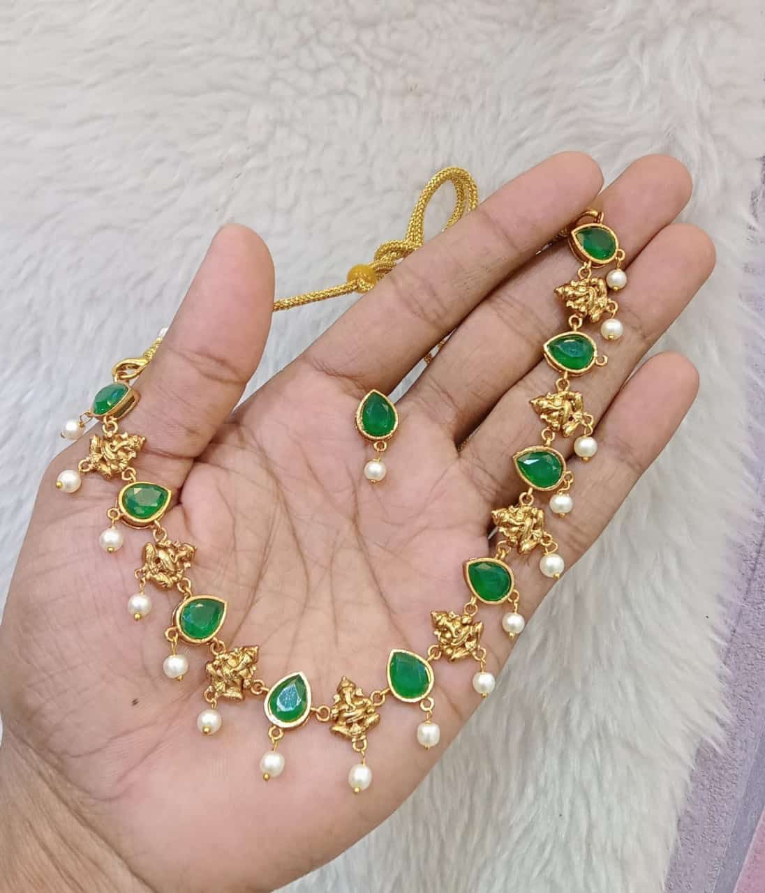 Emerald Green stones with Maa Lakshmi adorned with tiny pearls necklace set