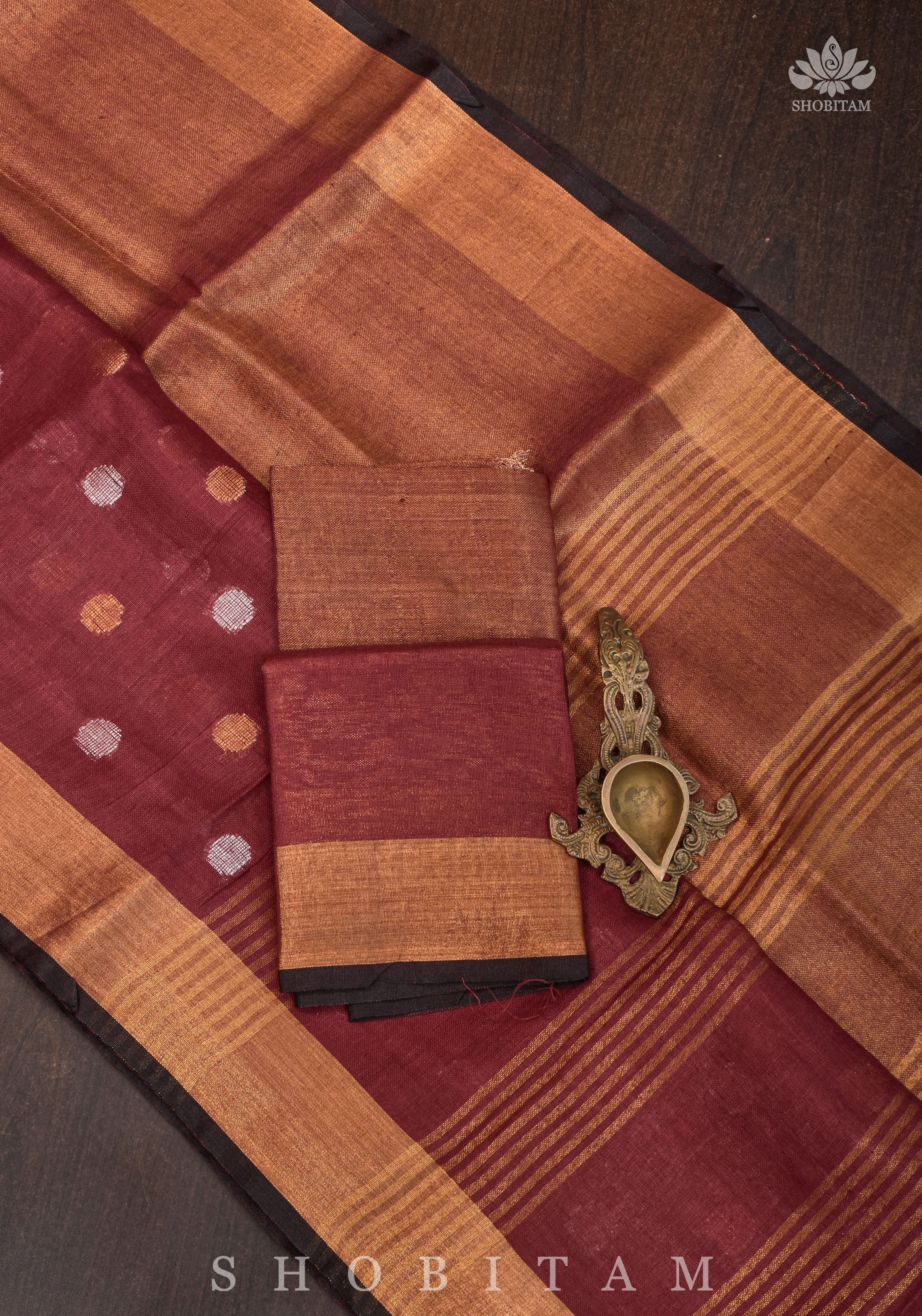 Maroon Tissue Body Linen Saree in Muted Antique Gold with Sona Rupa Polka Dots Skirt Border | Shobitam