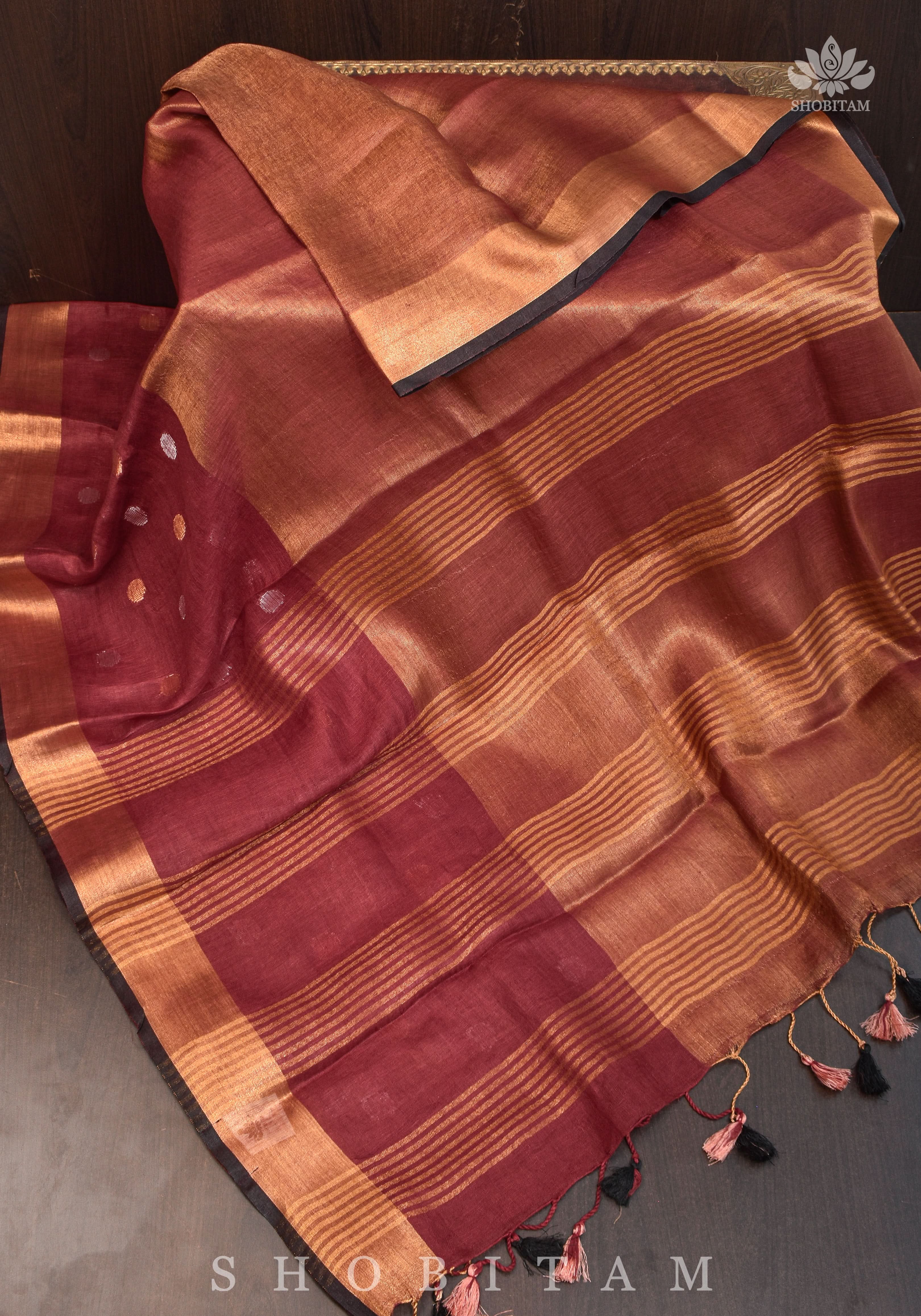 Maroon Tissue Body Linen Saree in Muted Antique Gold with Sona Rupa Polka Dots Skirt Border | Shobitam