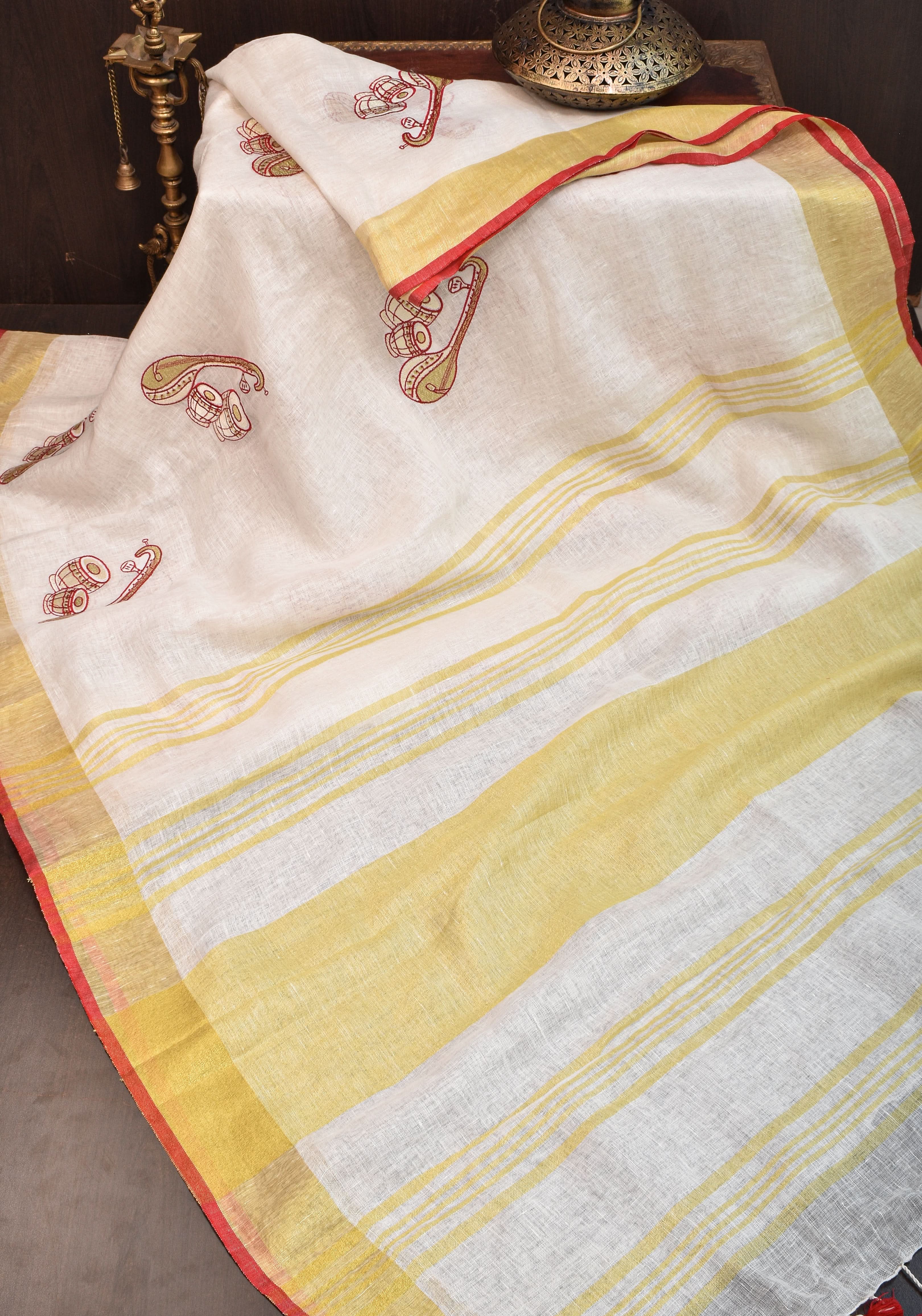 Linen by Linen Saree in White with Musical instruments embroidery motifs | Shobitam