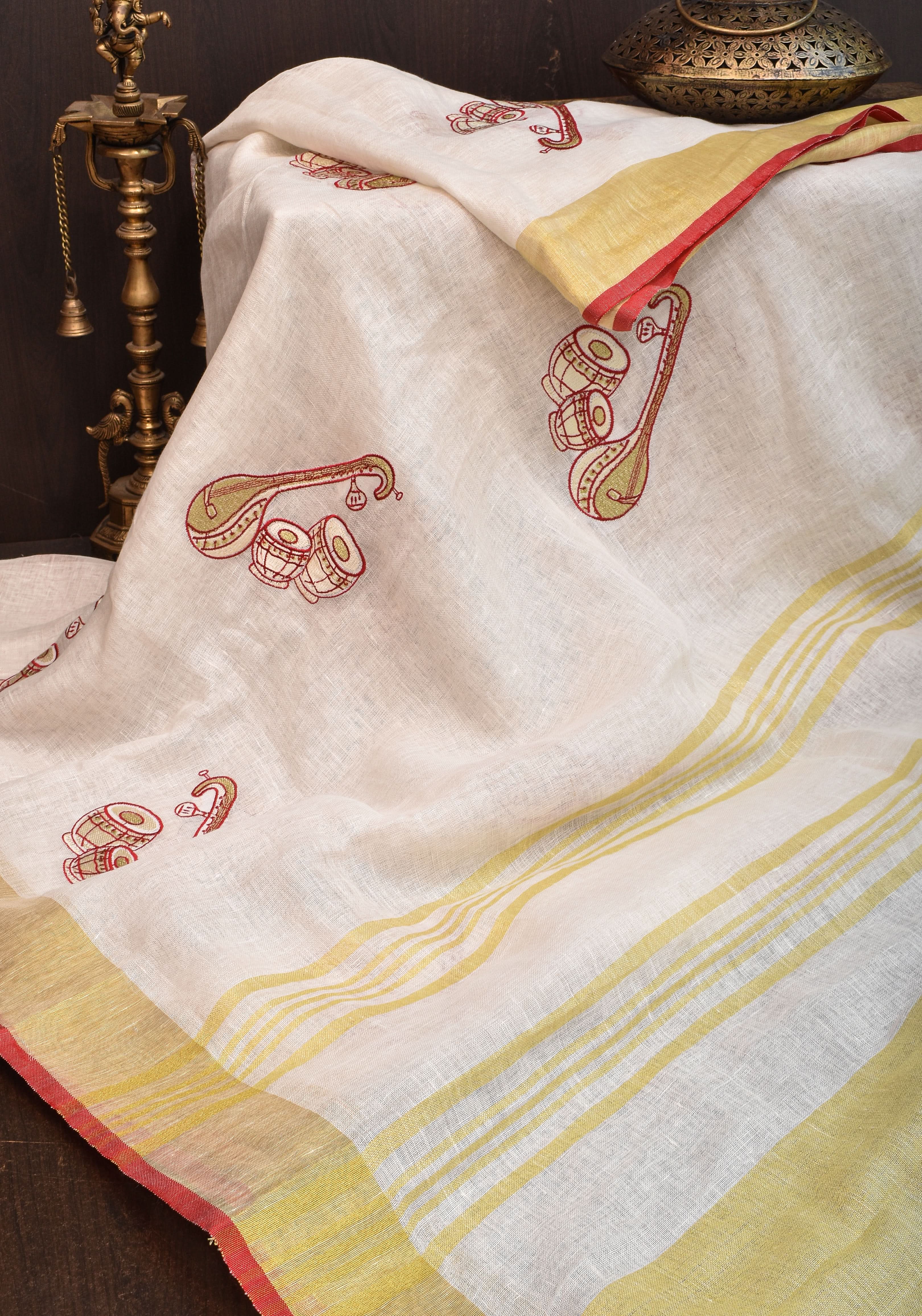 Linen by Linen Saree in White with Musical instruments embroidery motifs | Shobitam