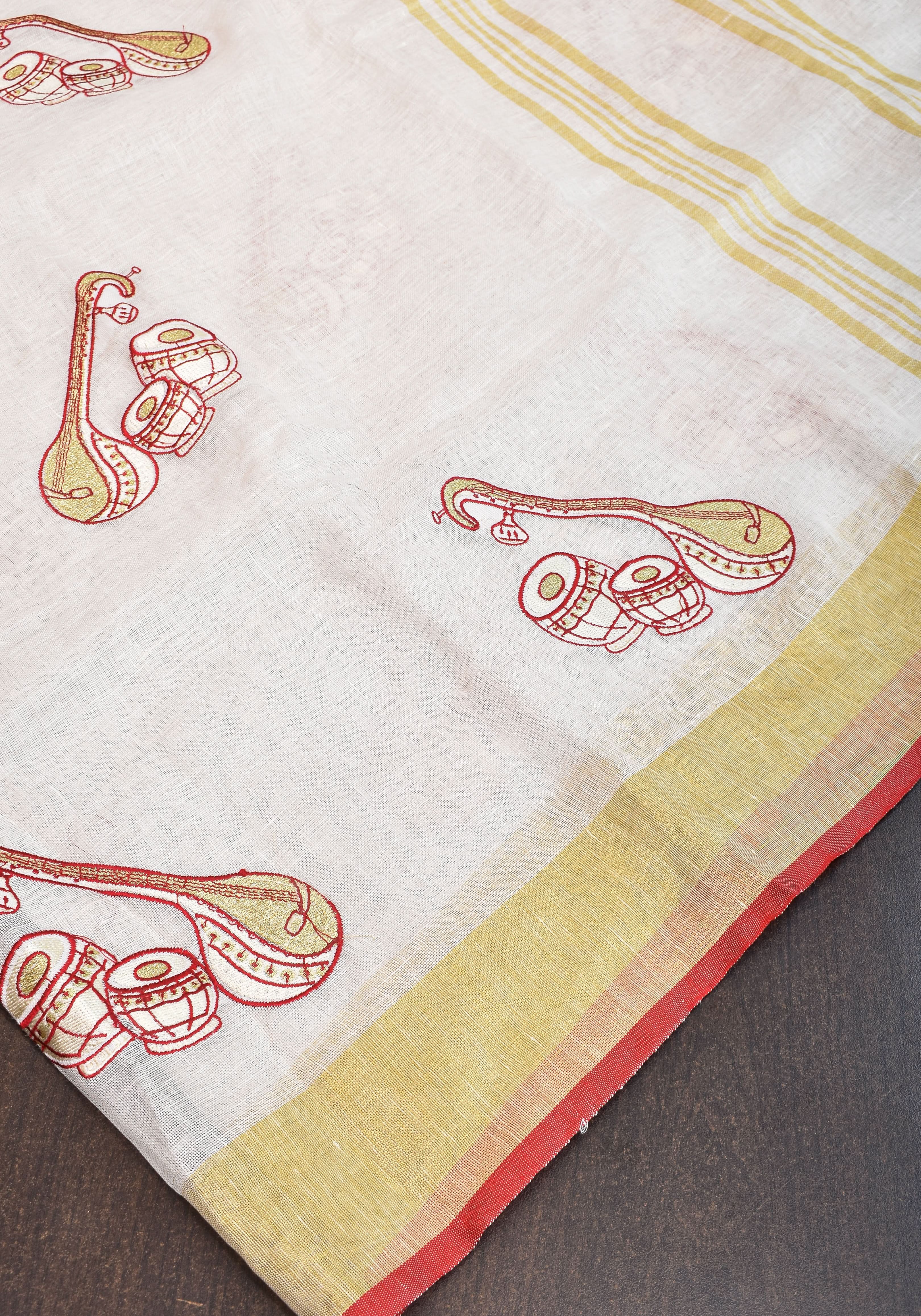 Linen by Linen Saree in White with Musical instruments embroidery motifs | Shobitam