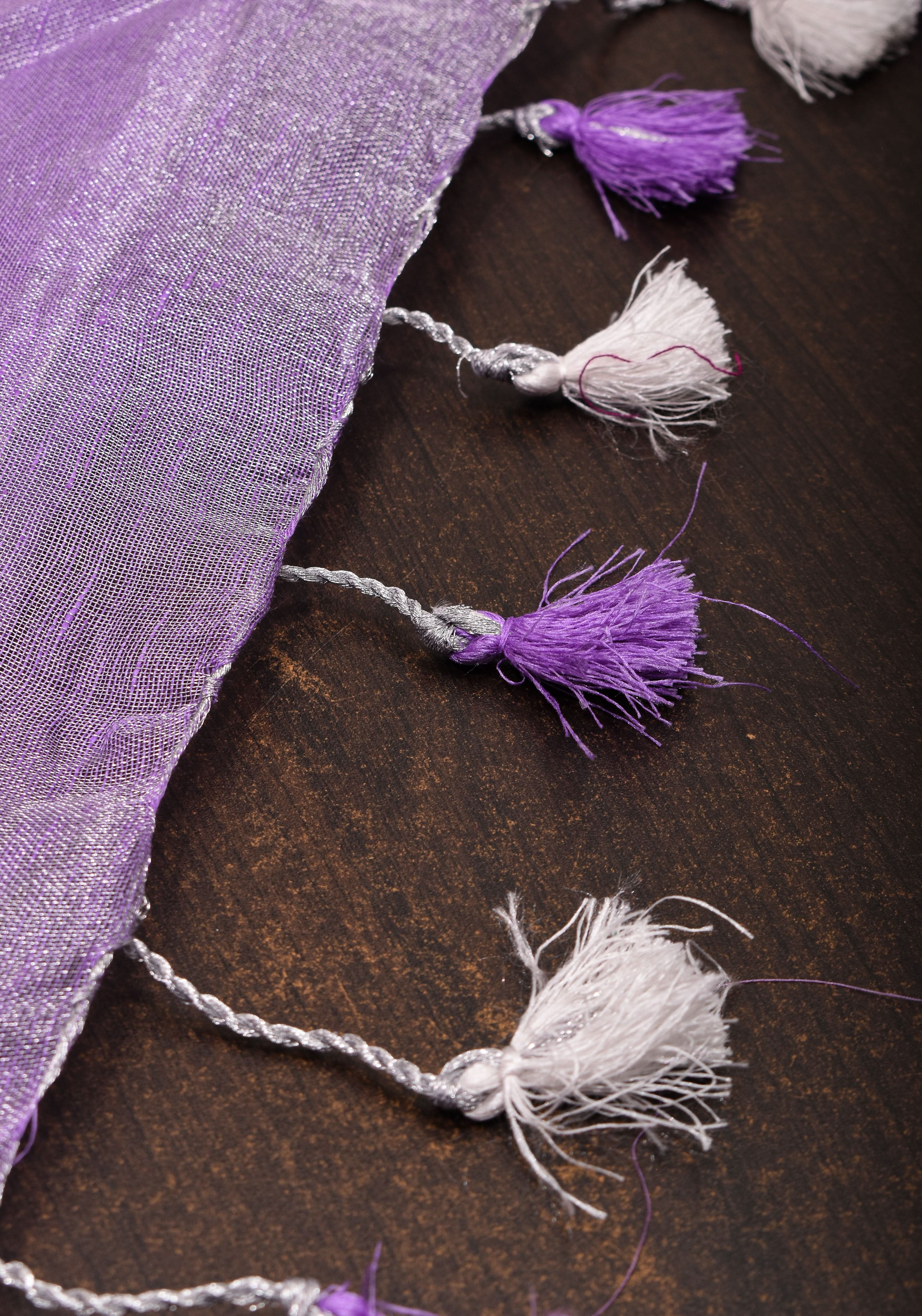 Lavender Hued Tissue Linen Saree with silver zari borders and long tassels! | Shobitam