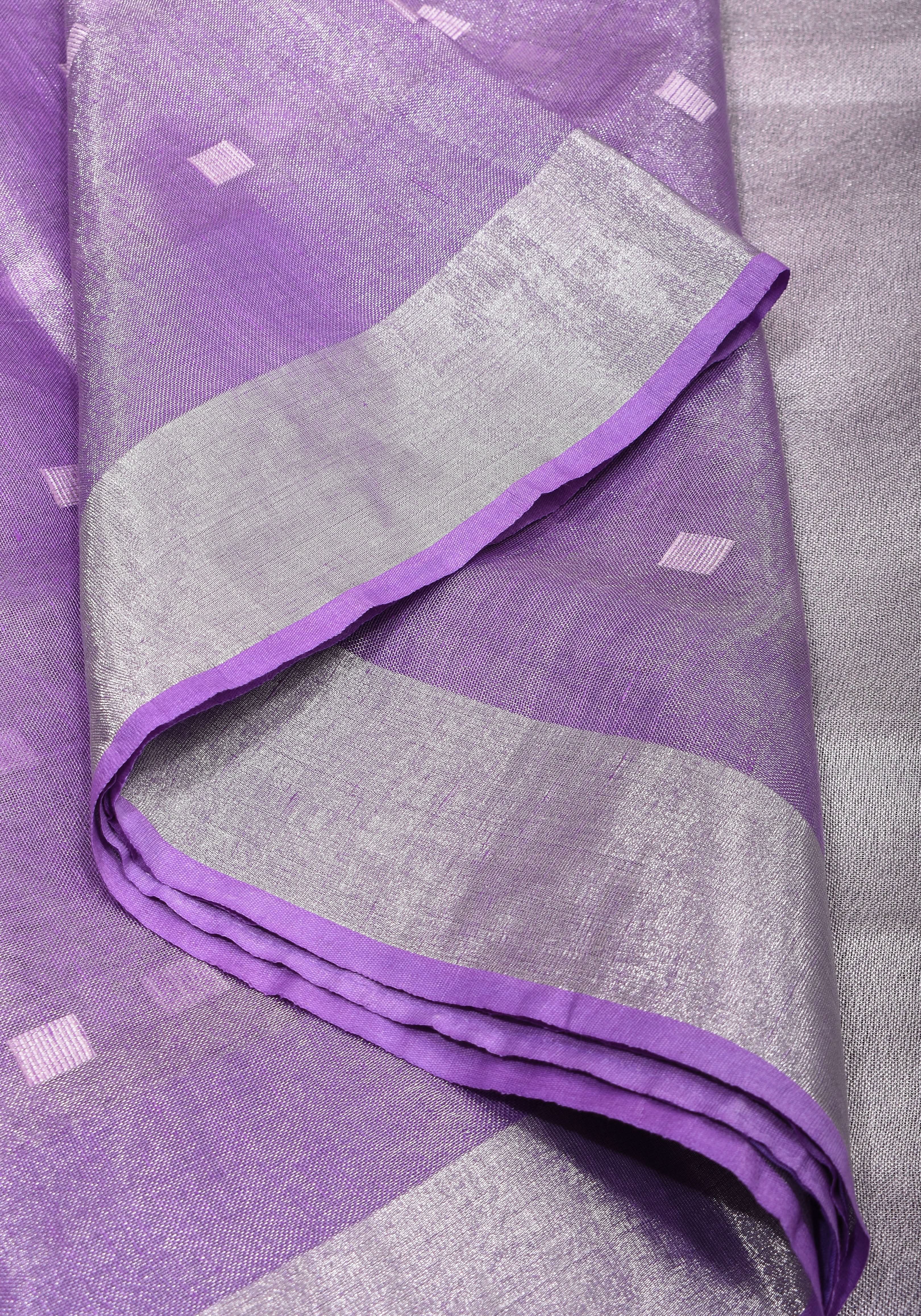 Lavender Hued Tissue Linen Saree with silver zari borders and long tassels! | Shobitam