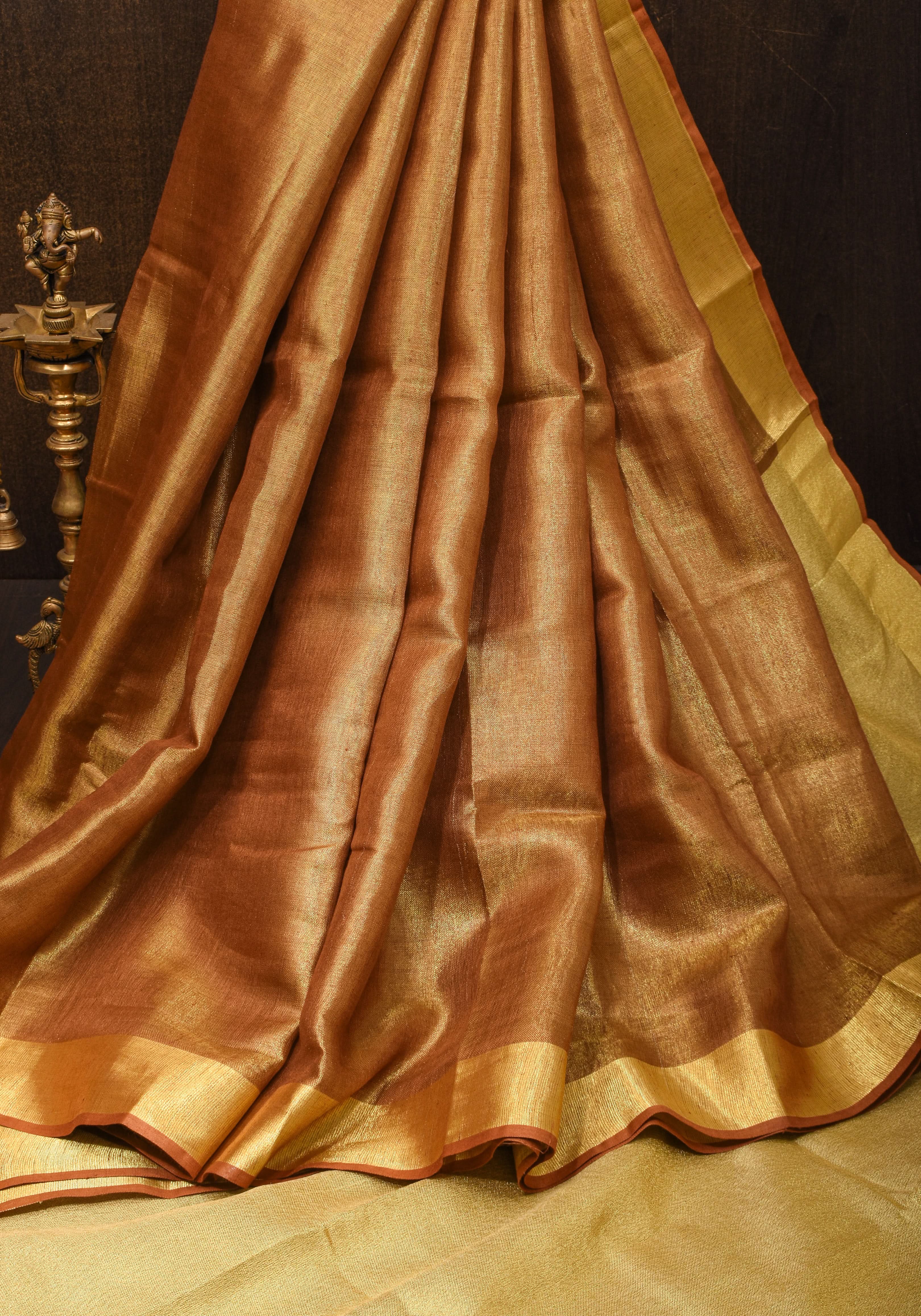 Caramel and Gold Tissue Linen Saree with Zari Border and long tassels | Shobitam