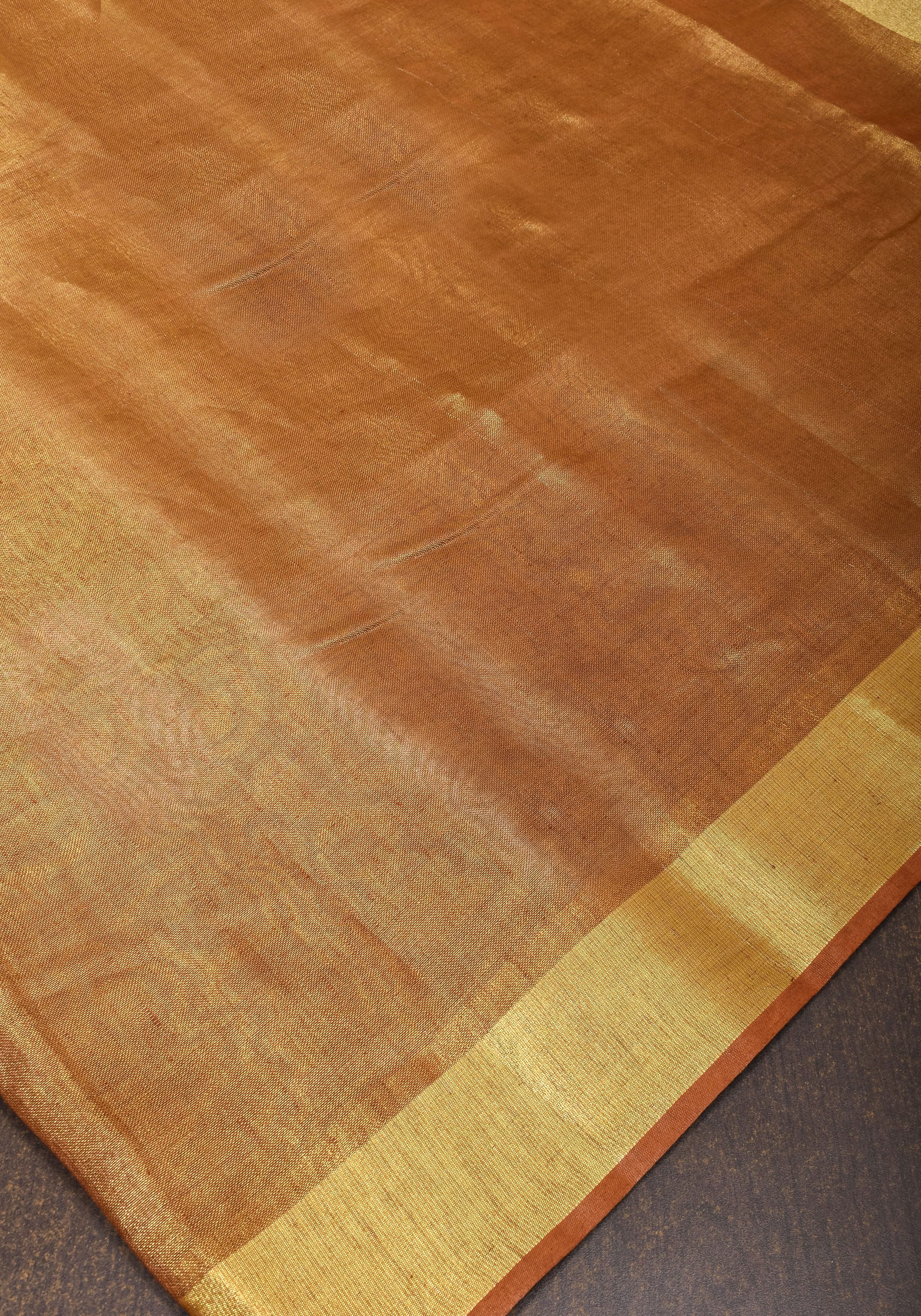 Caramel and Gold Tissue Linen Saree with Zari Border and long tassels | Shobitam