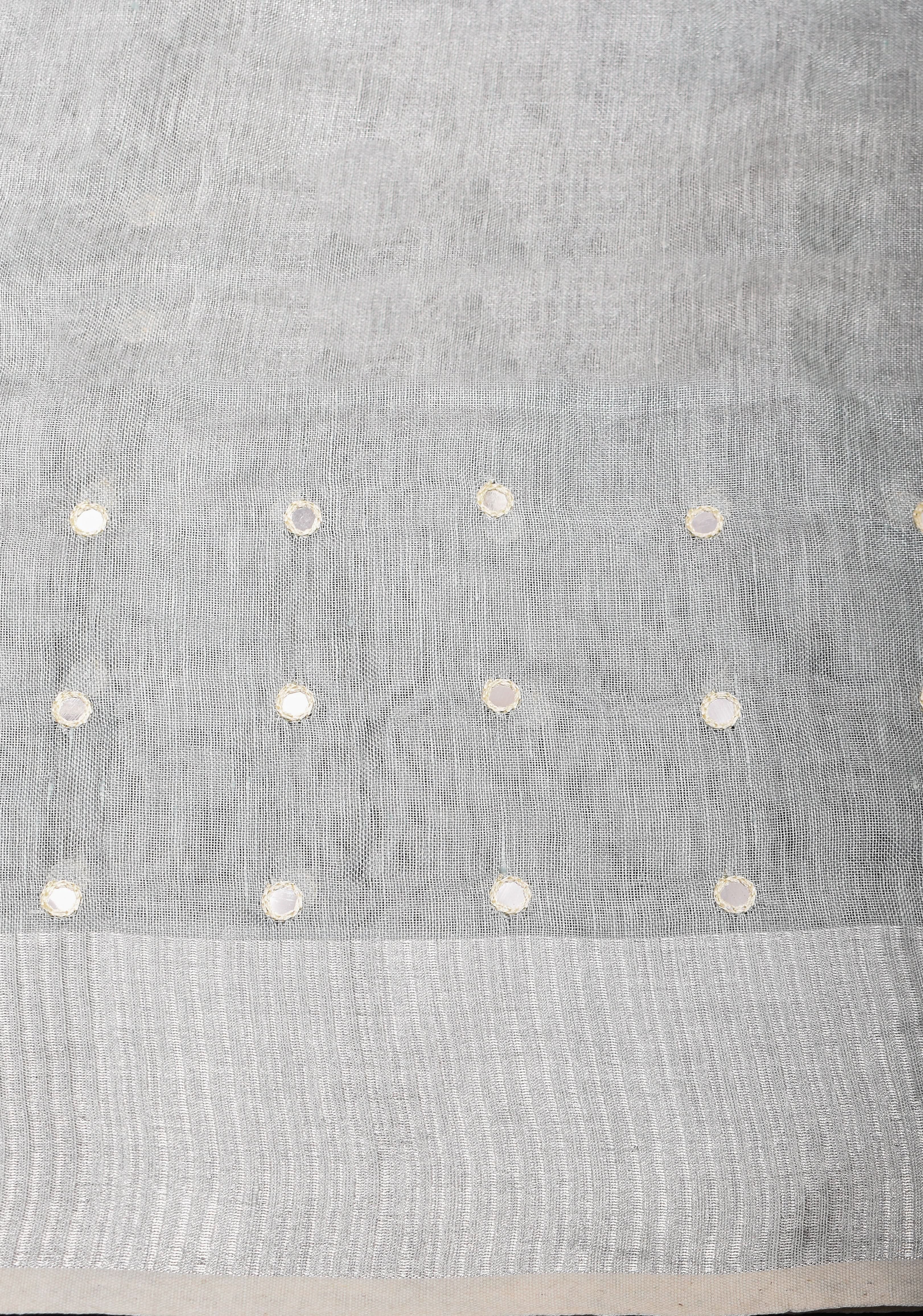 Cutwork and Mirror Work Tissue Linen Saree in White Silver with dramatic tassels | Shobitam