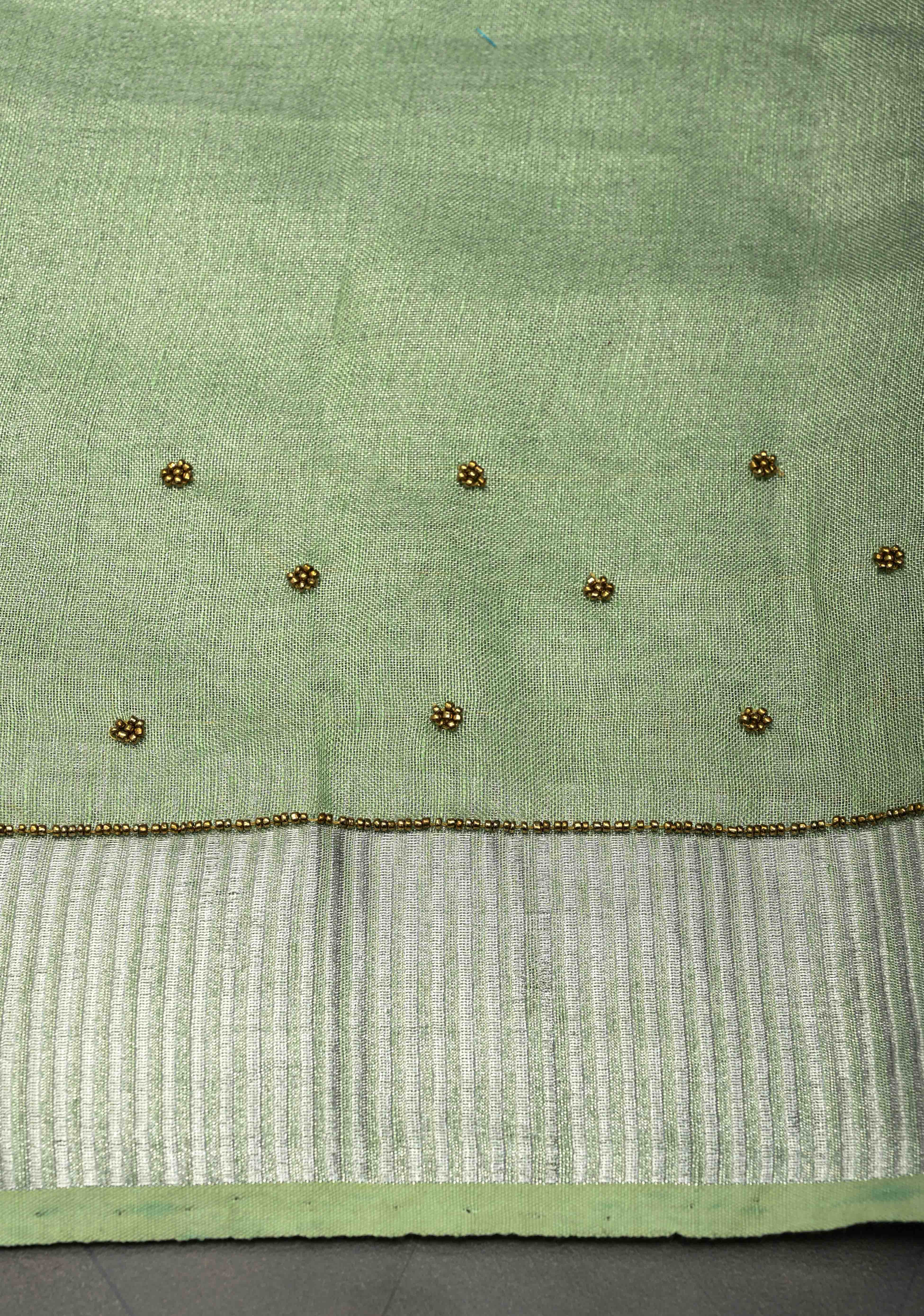 Hand Beadwork and Embroidery on Tissue Linen Saree in Sage Green and silver | Shobitam