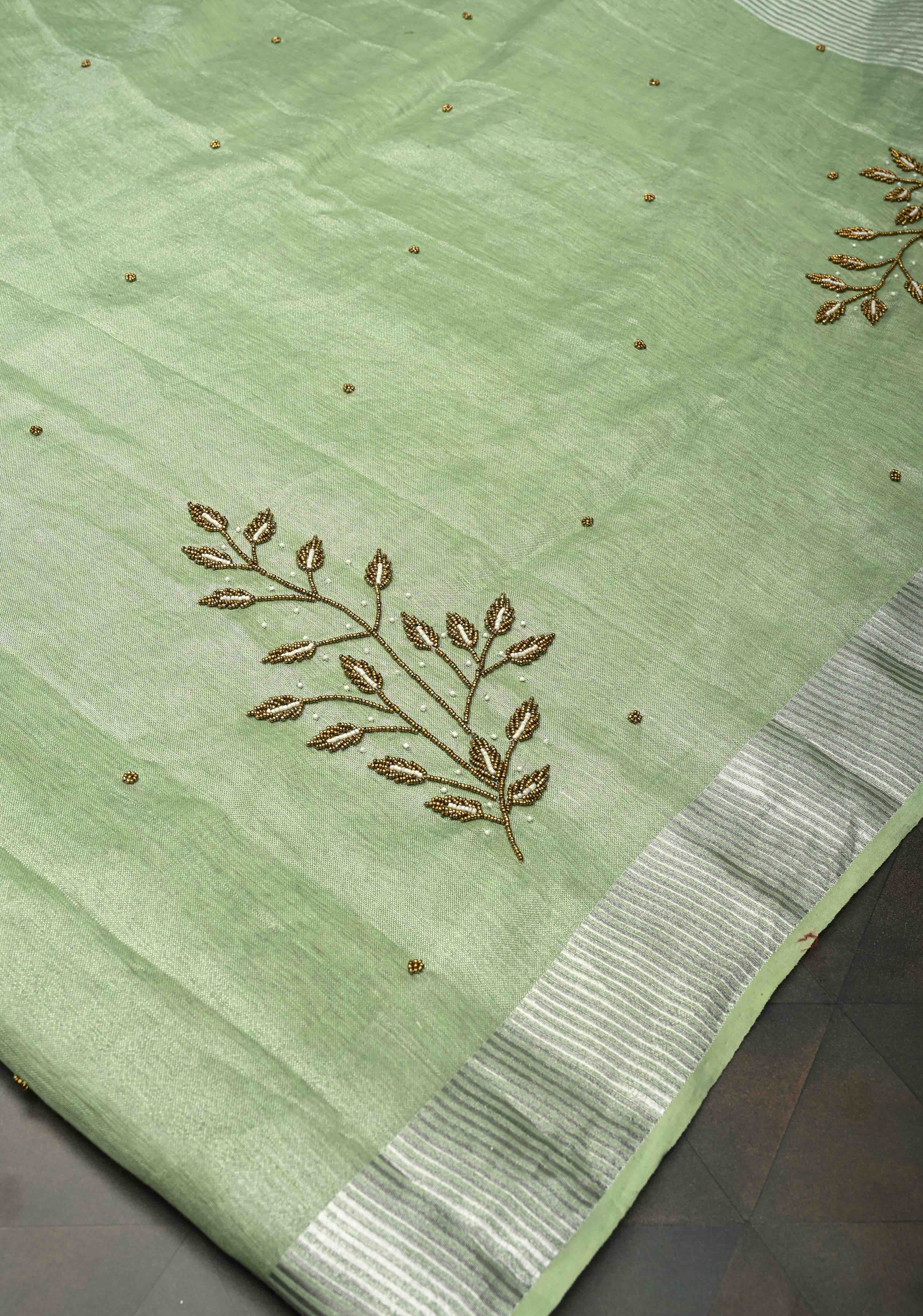 Hand Beadwork and Embroidery on Tissue Linen Saree in Sage Green and silver | Shobitam
