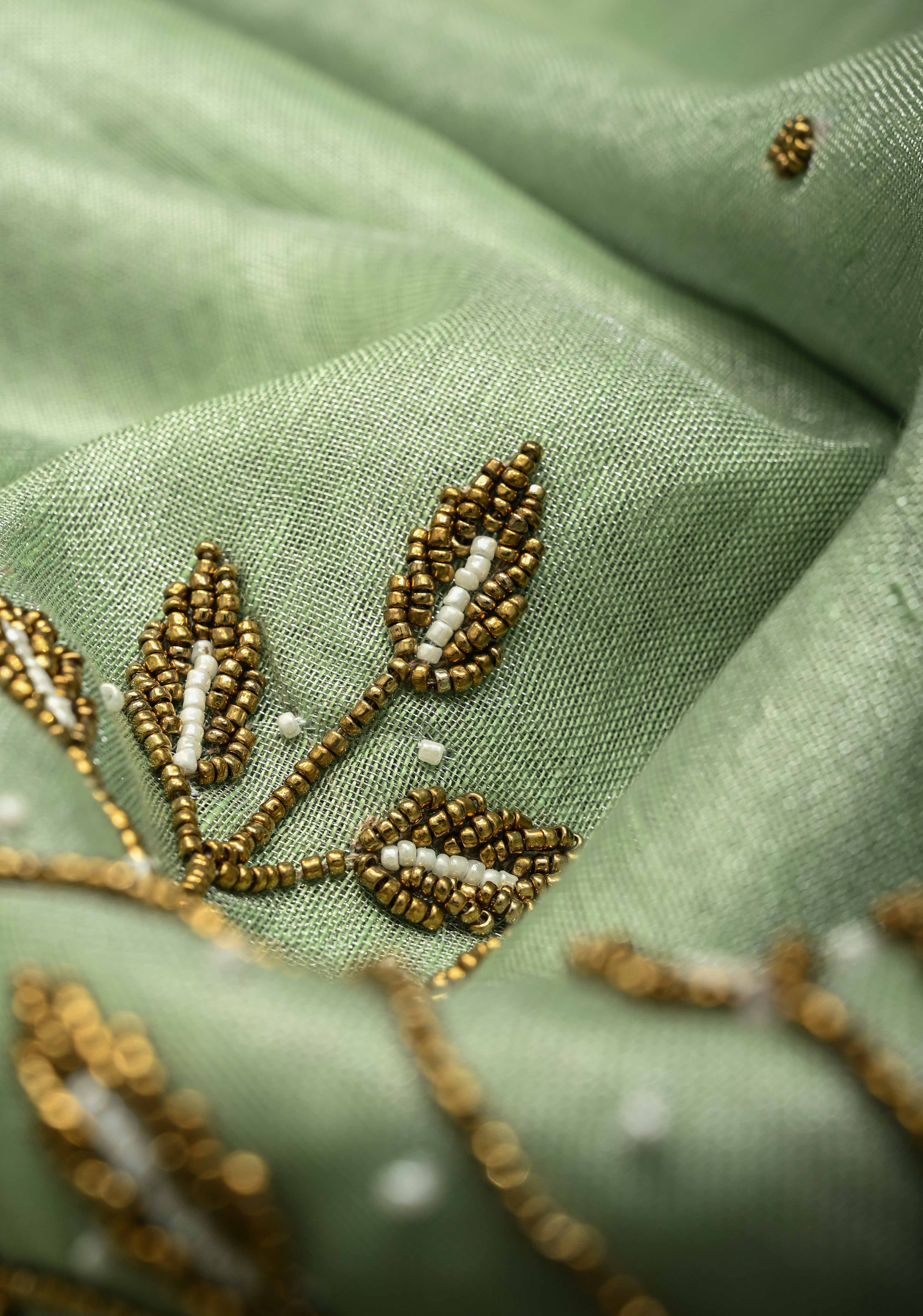 Hand Beadwork and Embroidery on Tissue Linen Saree in Sage Green and silver | Shobitam