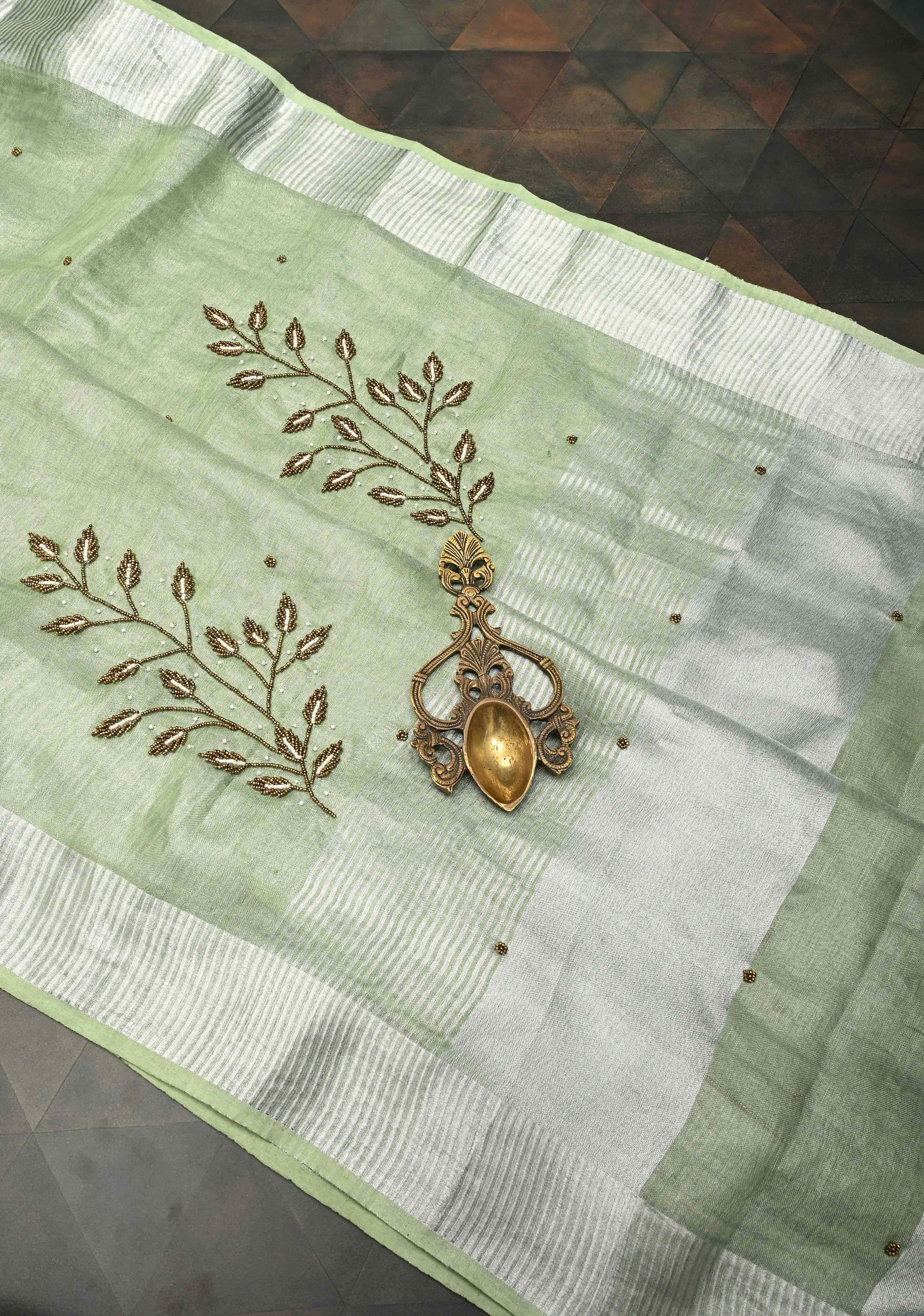 Hand Beadwork and Embroidery on Tissue Linen Saree in Sage Green and silver | Shobitam