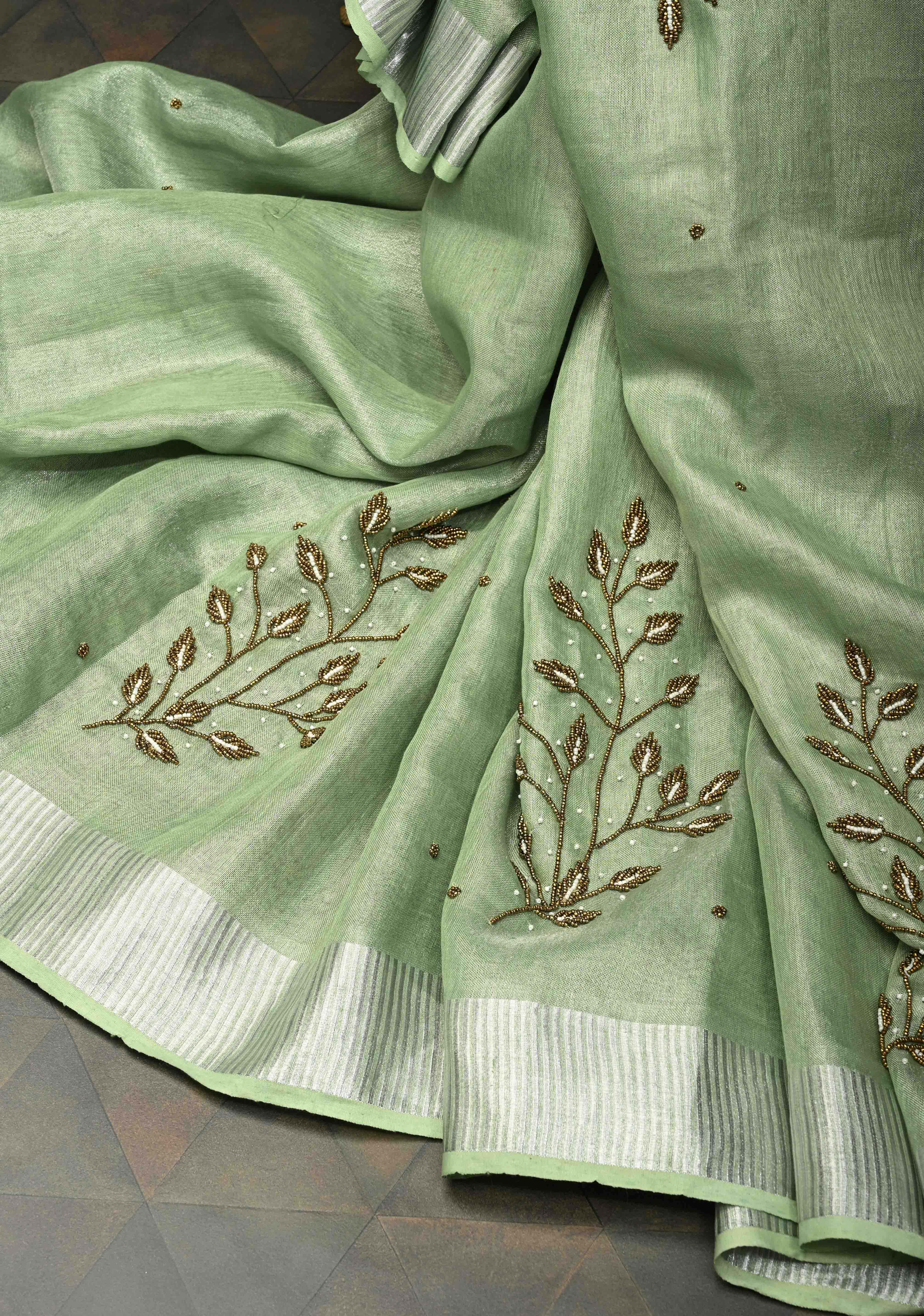 Hand Beadwork and Embroidery on Tissue Linen Saree in Sage Green and silver | Shobitam