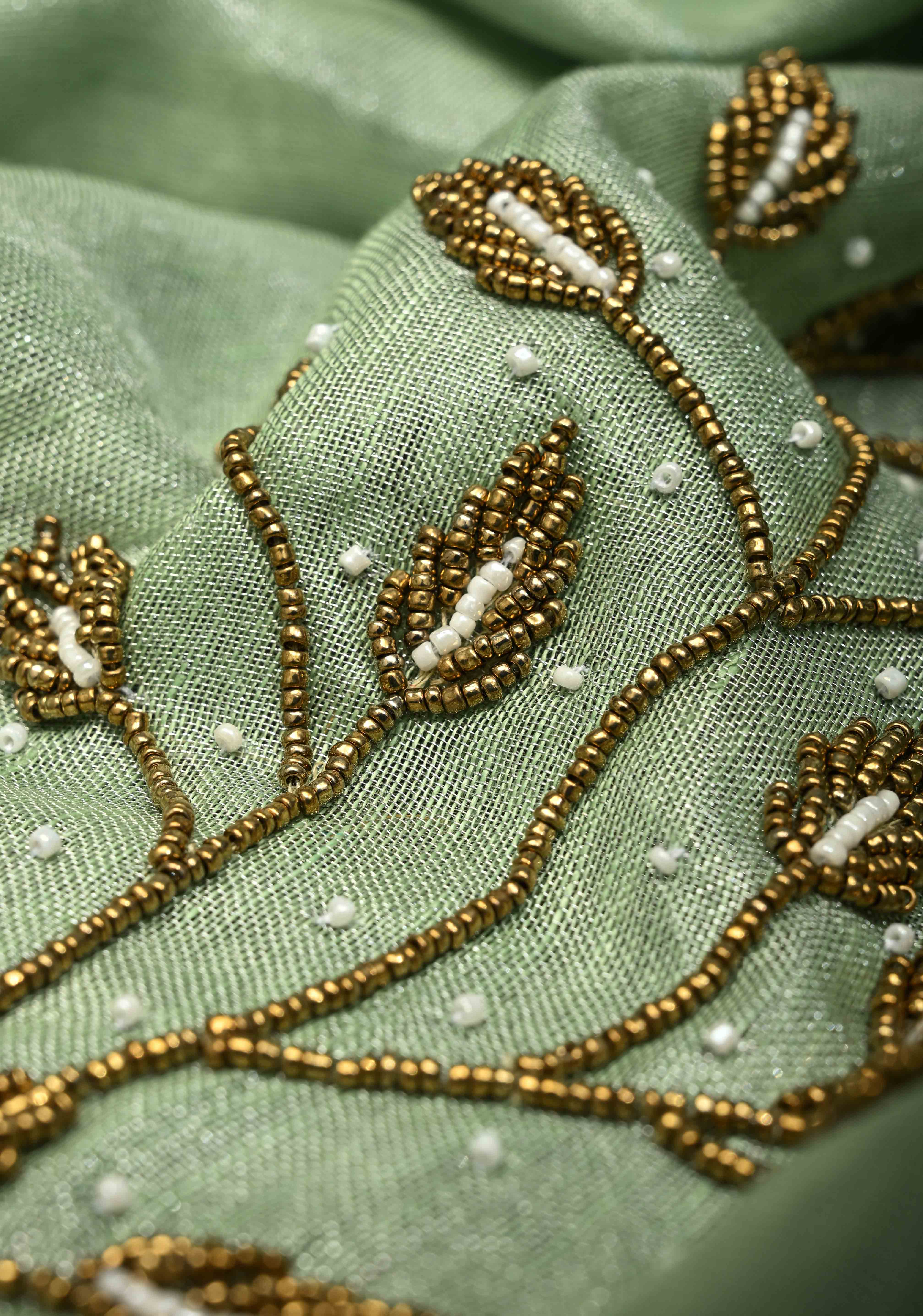 Hand Beadwork and Embroidery on Tissue Linen Saree in Sage Green and silver | Shobitam