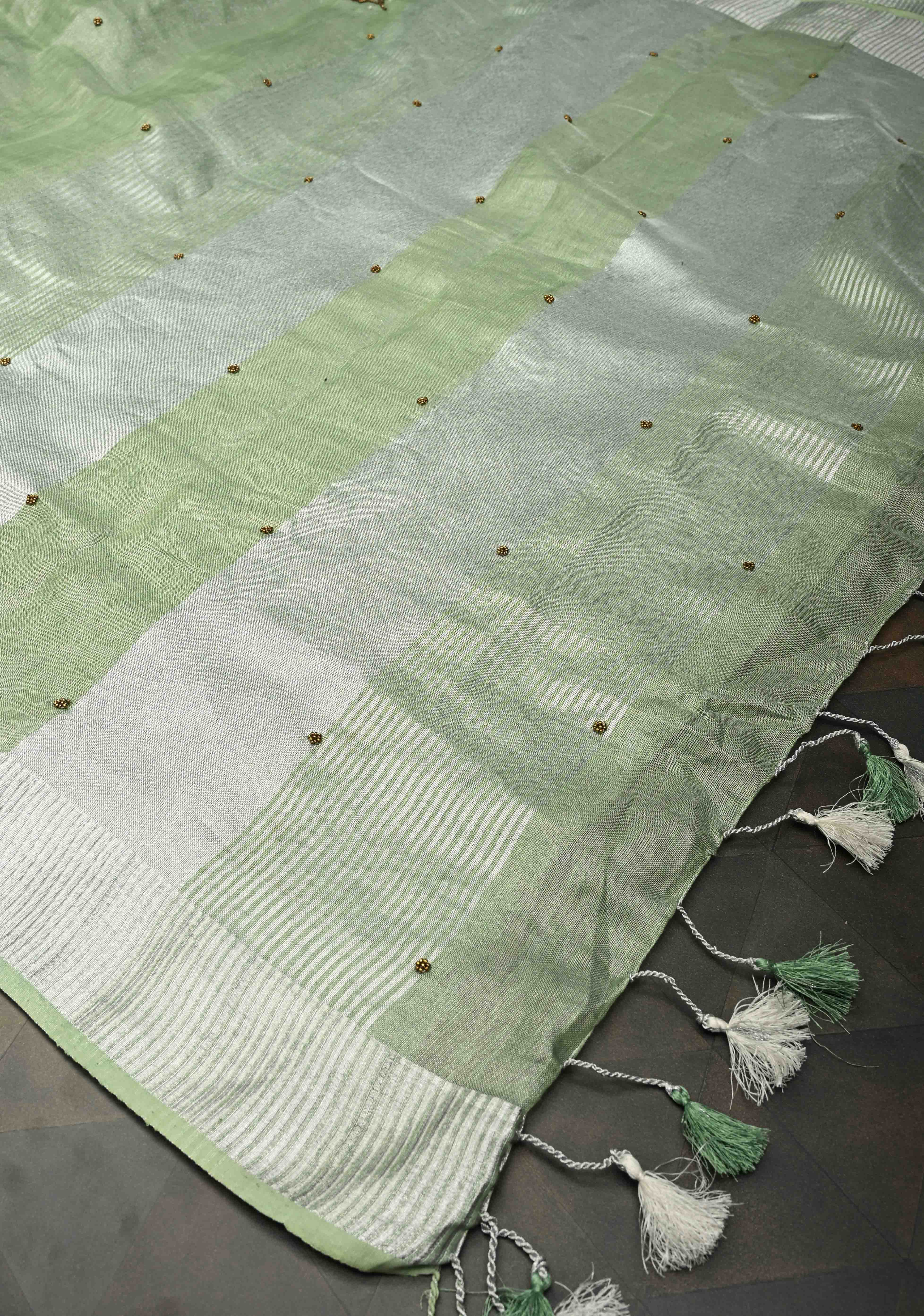 Hand Beadwork and Embroidery on Tissue Linen Saree in Sage Green and silver | Shobitam