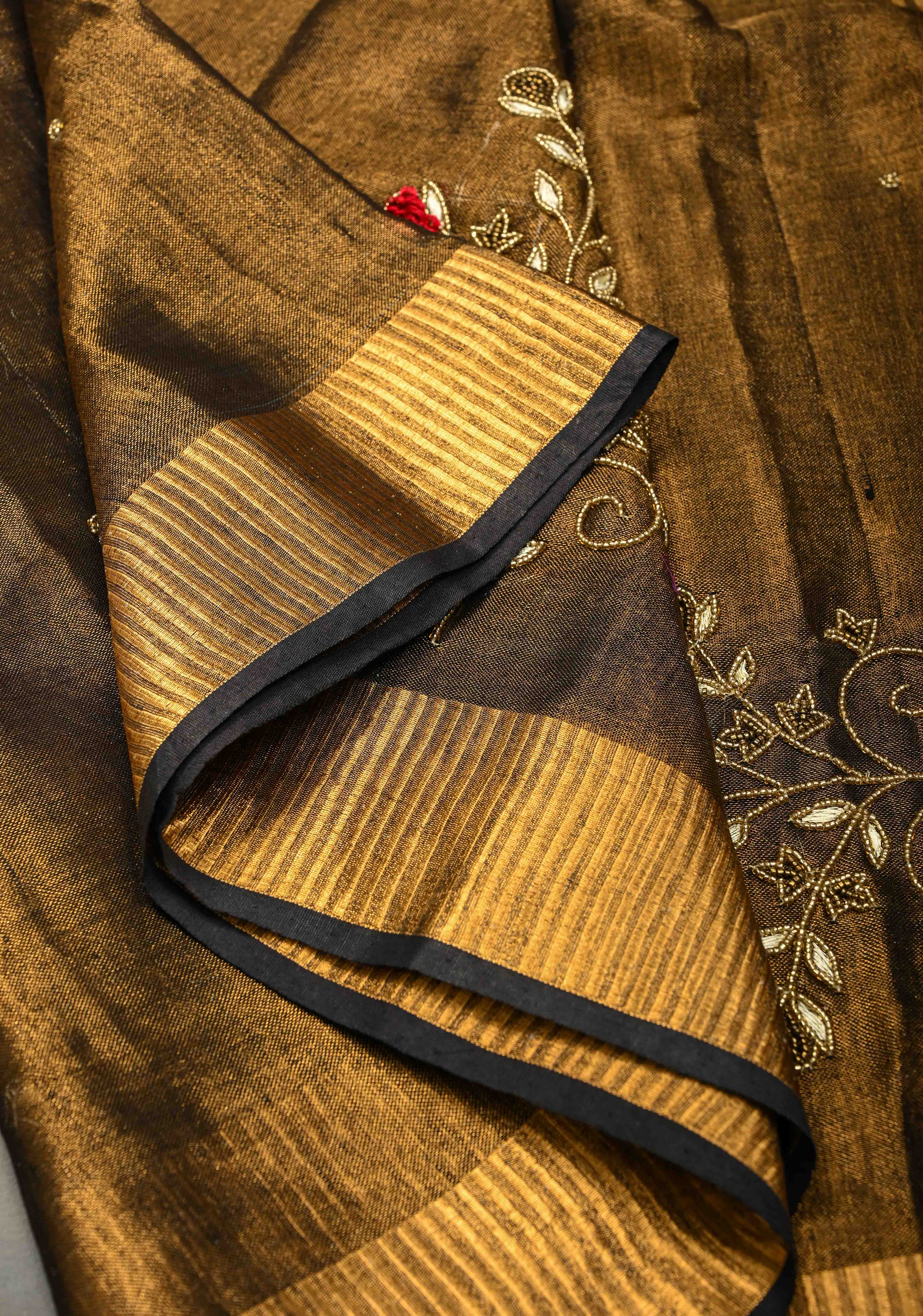 Hand Embroidery and Beadwork in copper and Black on Tissue Linen Saree | Shobitam