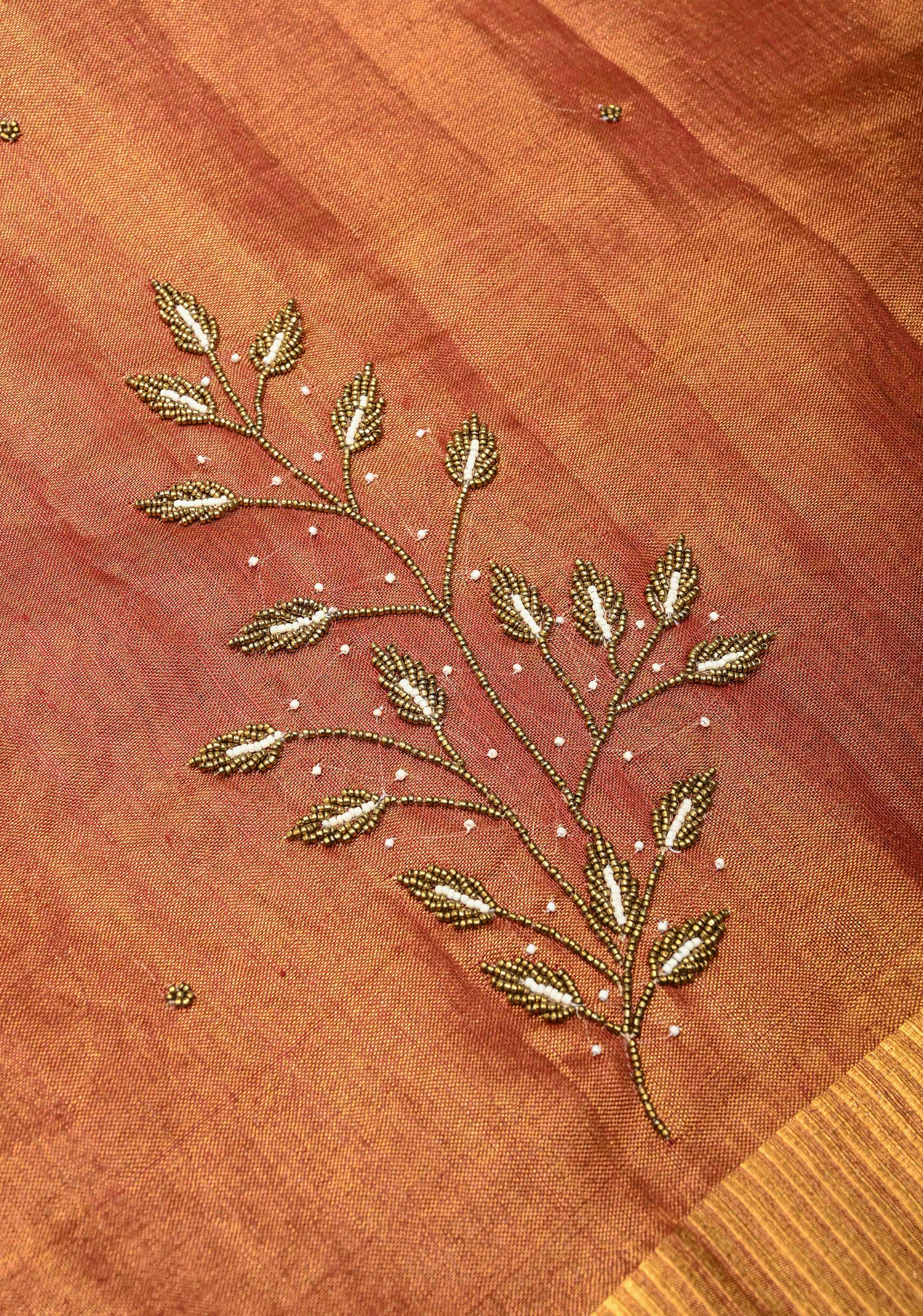 Golden Tissue Linen Saree in Reddish-Brown with Bead Embellishments | Shobitam