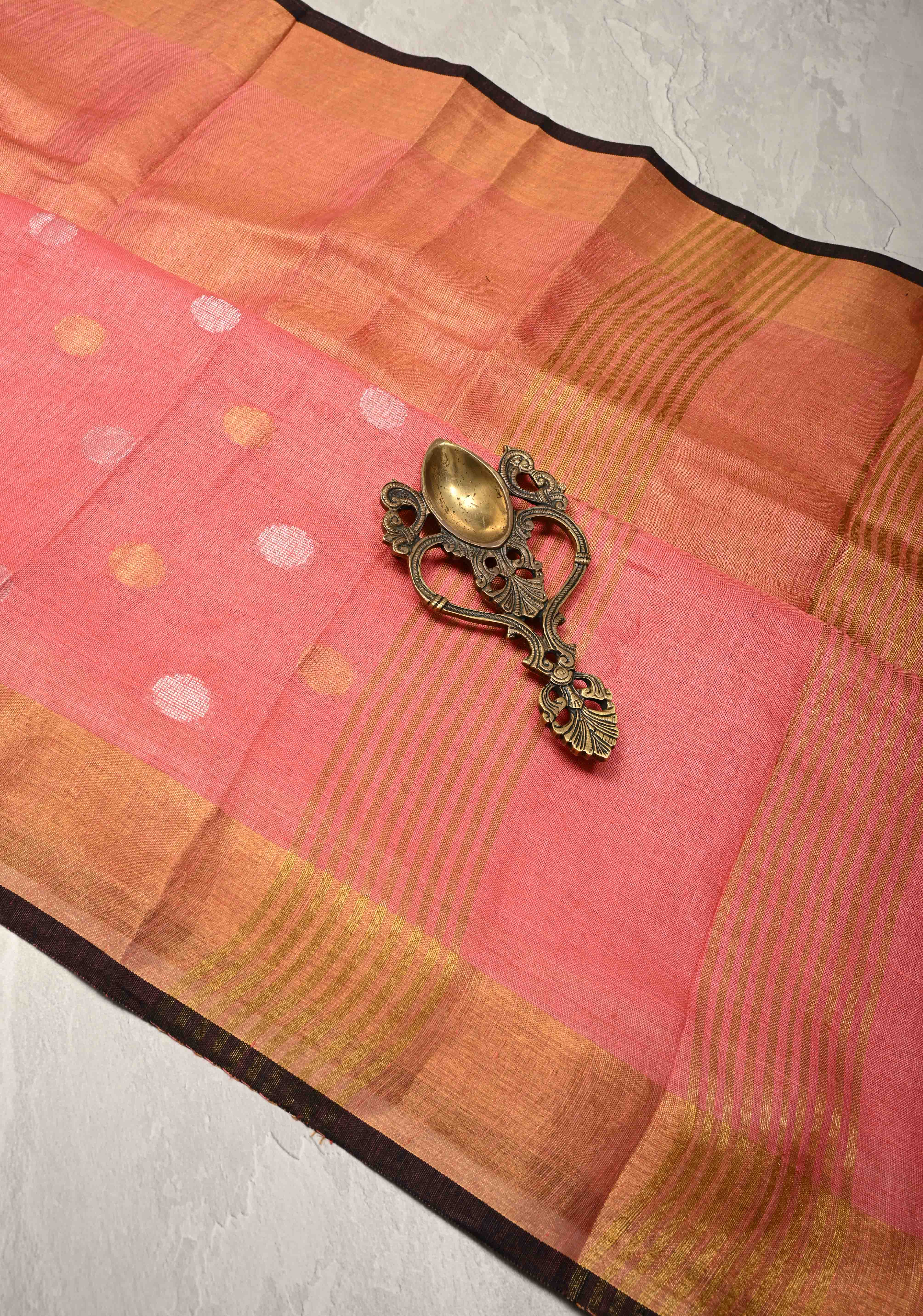 Salmon Pink Tissue Body Linen Saree in Muted Antique Gold with Sona Rupa Polka Dots Skirt Border | Shobitam