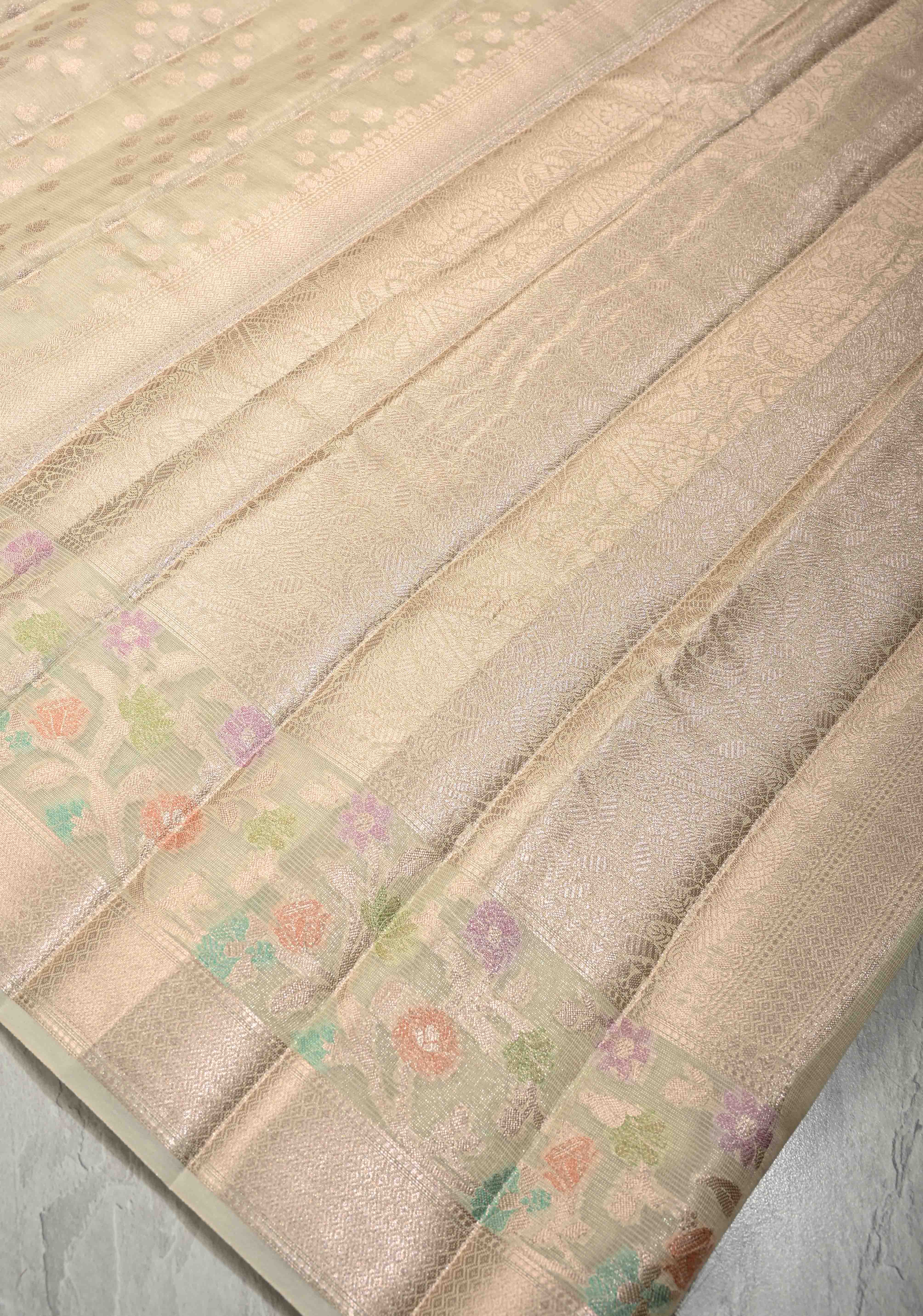 Ivory Tissue Kanjivaram Semi Silk Saree with  Leaf Buttas and Pastel meenakari Vine border | Shobitam