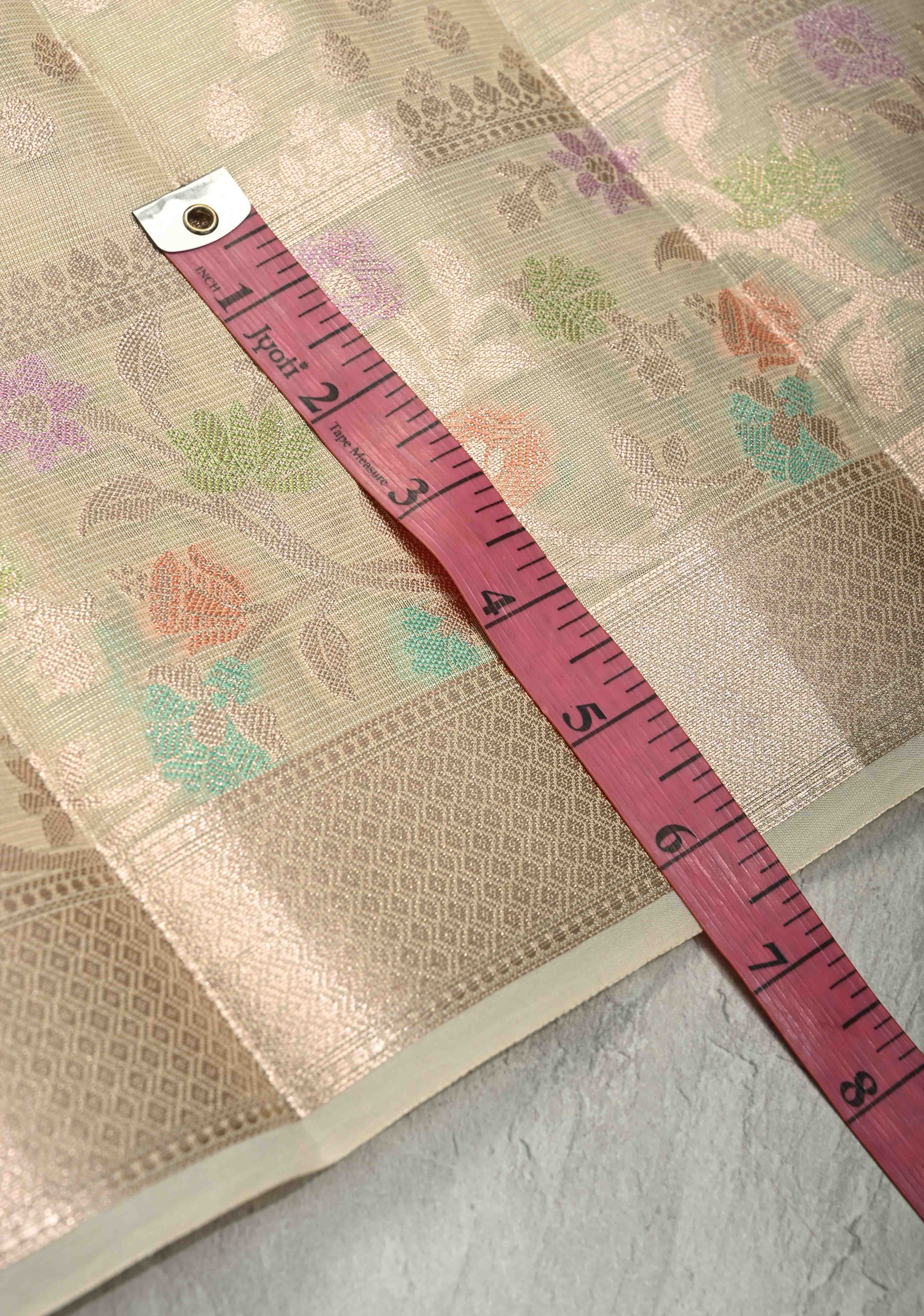 Ivory Tissue Kanjivaram Semi Silk Saree with  Leaf Buttas and Pastel meenakari Vine border | Shobitam