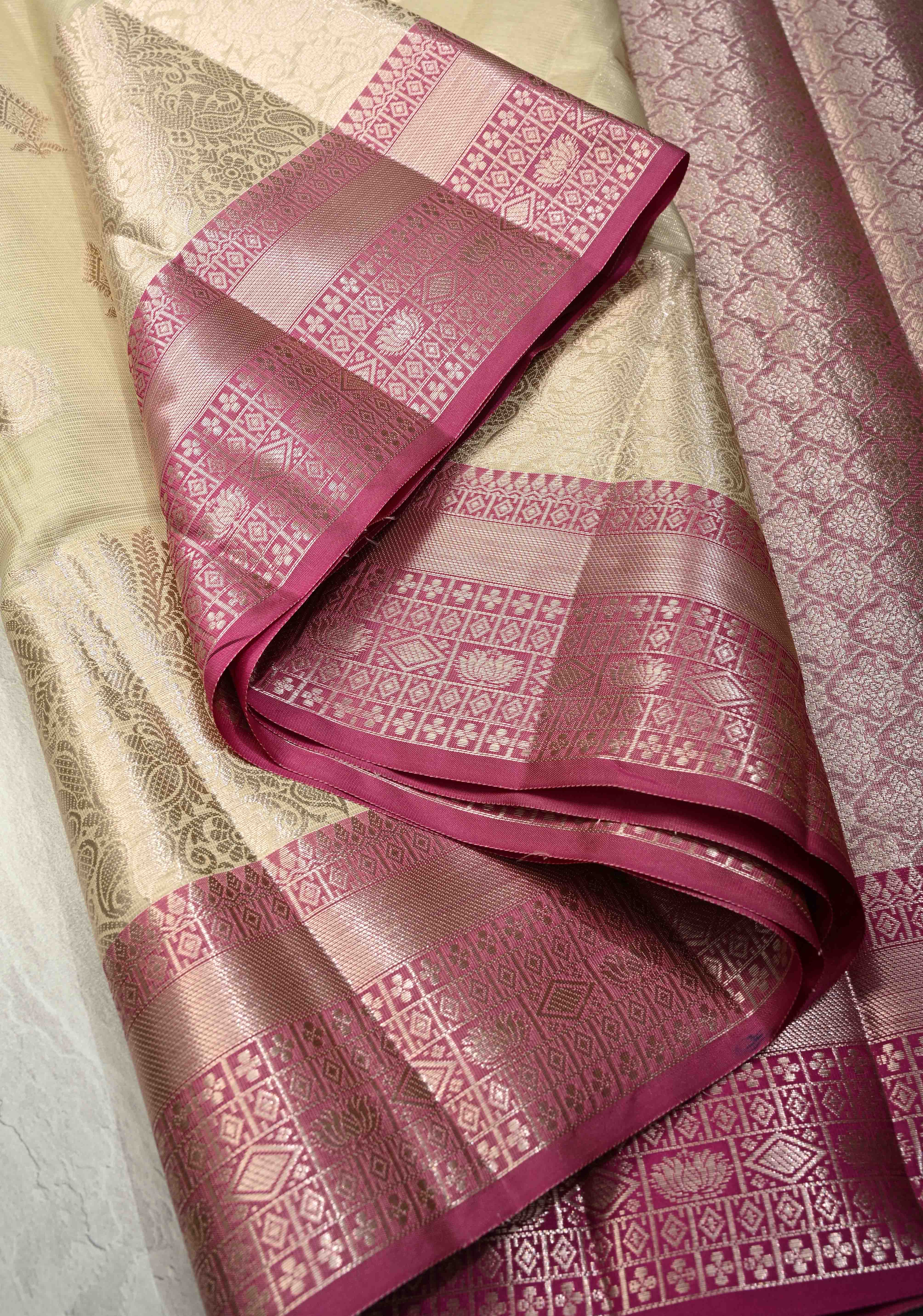Creamy Green Kanjivaram Tissue Semi Silk Saree with Zari Buttas and Contrast Zari Border | Shobitam
