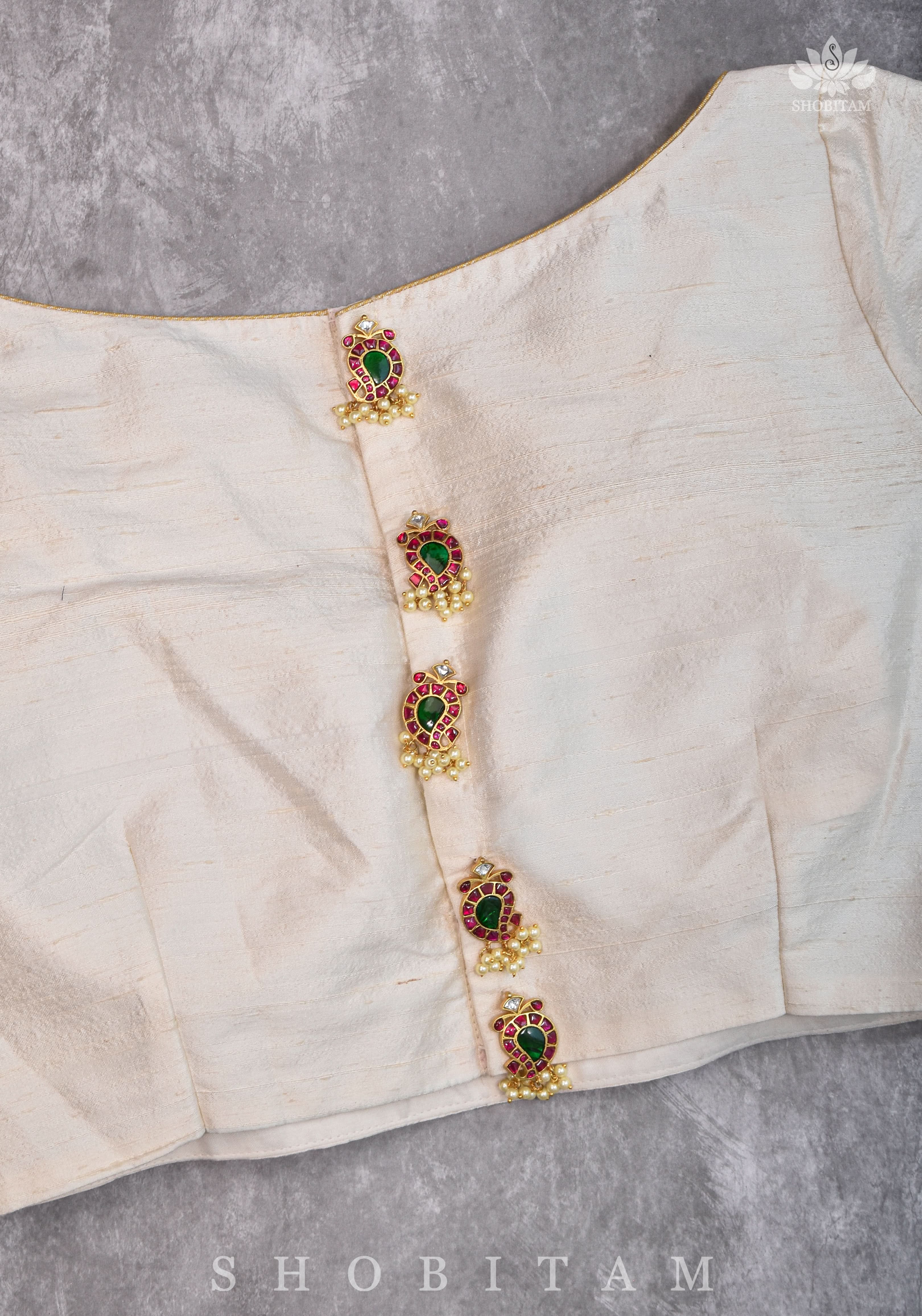 Ivory Pure Raw Silk Blouse with Kemp work detailing on boat neck and Jadau back buttons | Shobitam