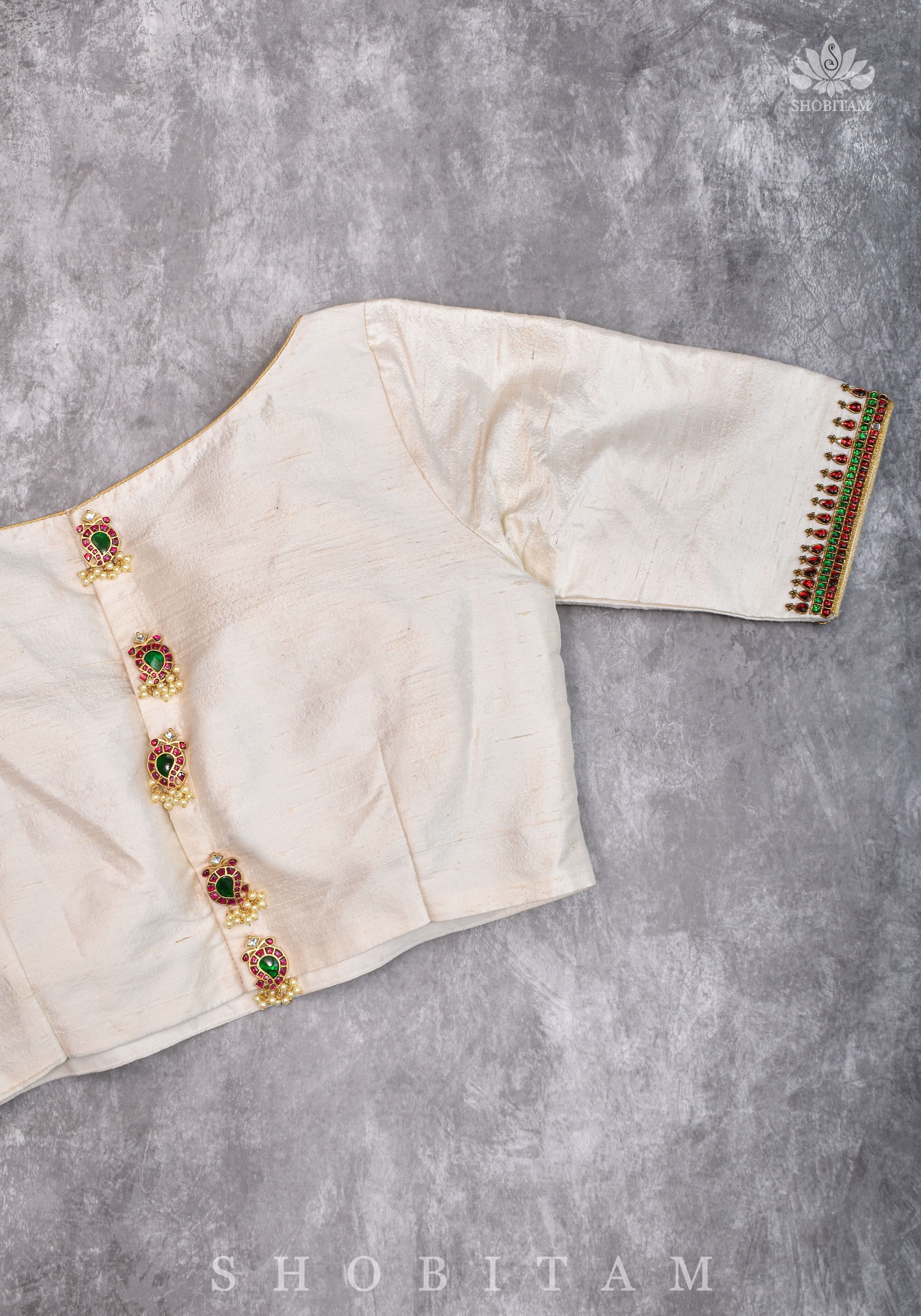 Ivory Pure Raw Silk Blouse with Kemp work detailing on boat neck and Jadau back buttons | Shobitam