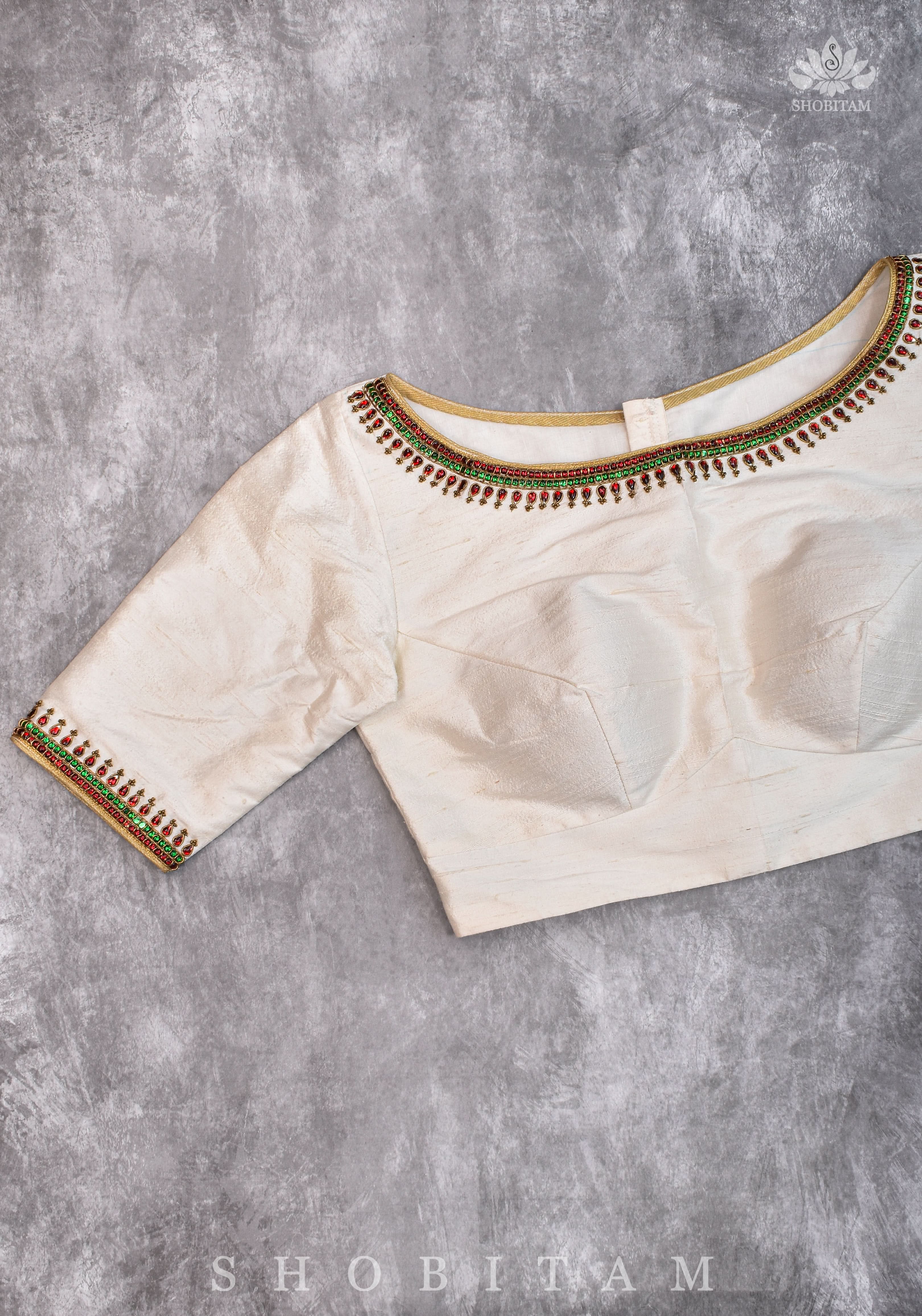 Ivory Pure Raw Silk Blouse with Kemp work detailing on boat neck and Jadau back buttons | Shobitam
