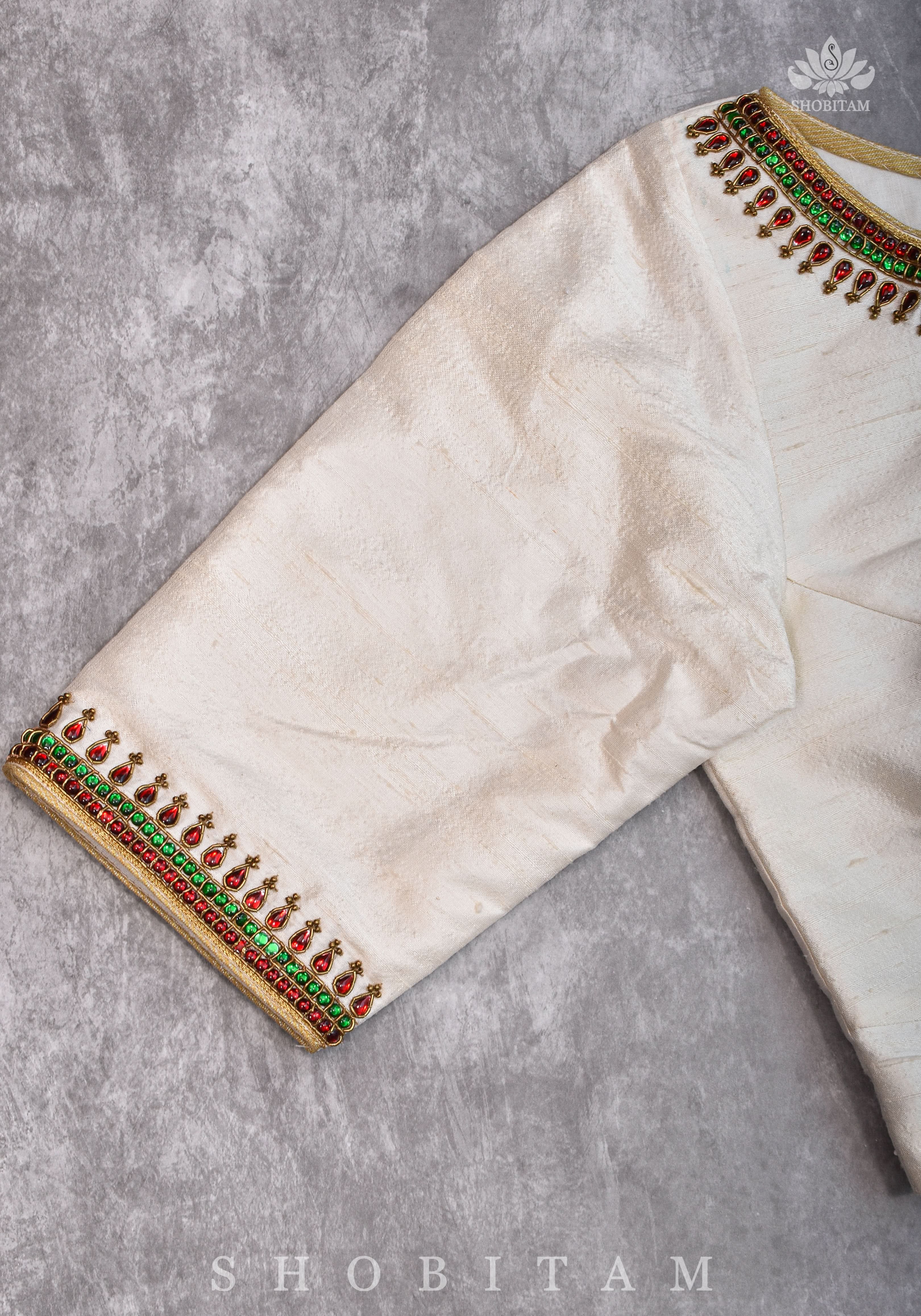 Ivory Pure Raw Silk Blouse with Kemp work detailing on boat neck and Jadau back buttons | Shobitam