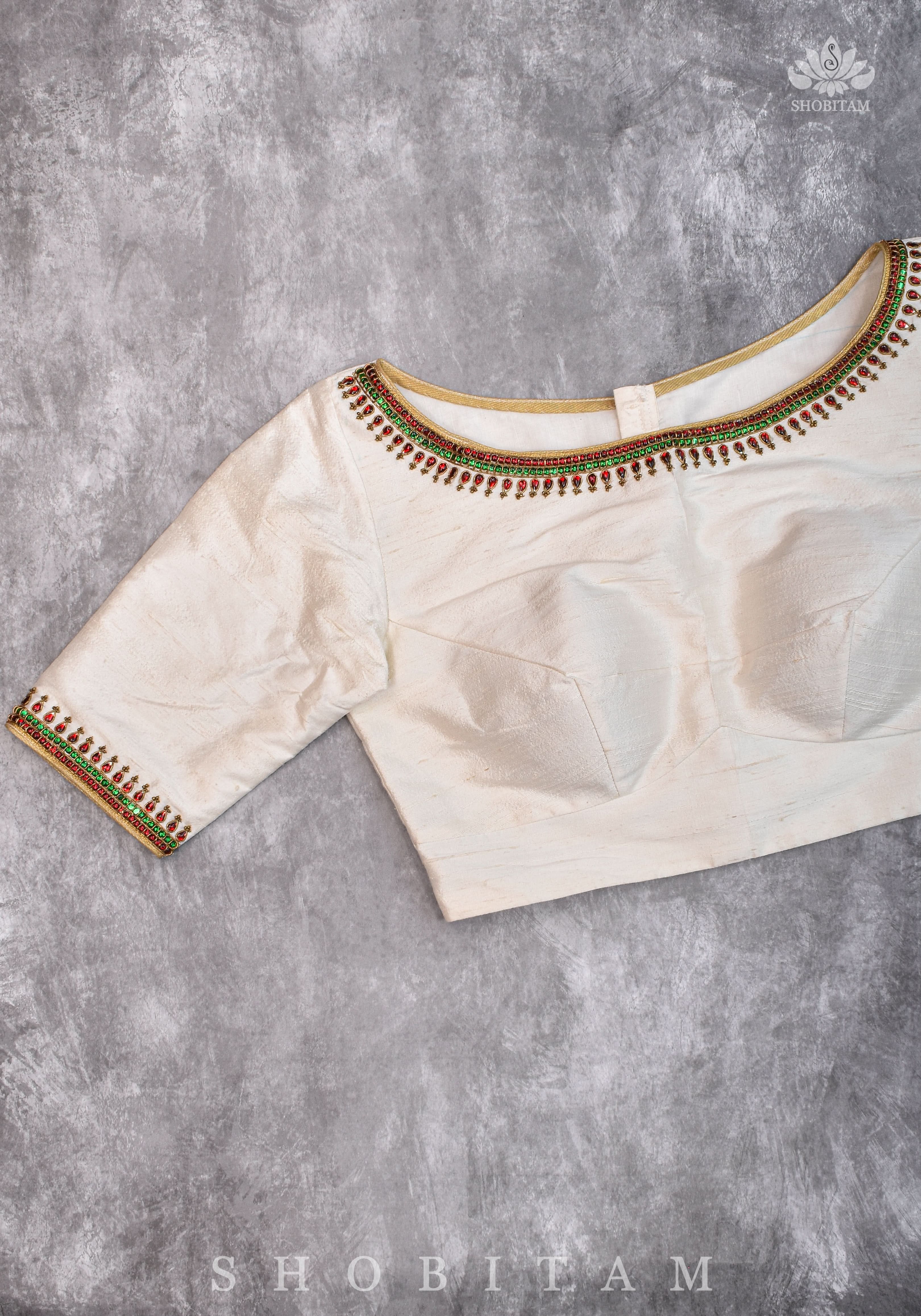 Ivory Pure Raw Silk Blouse with Kemp work detailing on boat neck and Jadau back buttons | Shobitam