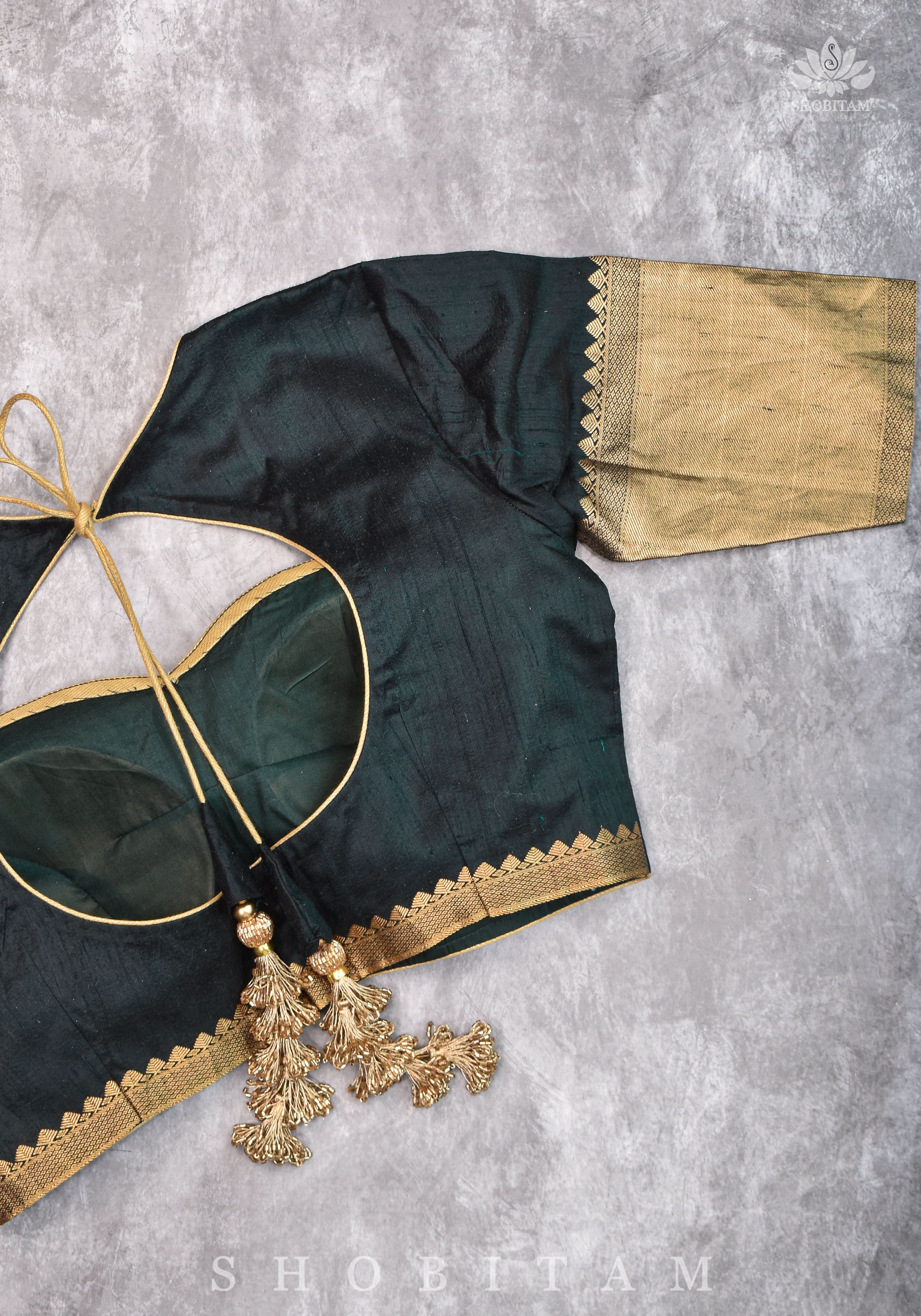 Green Pure Raw Silk Blouse with Leaf Neck, Zari detailing and Cutdana Tassels | Shobitam