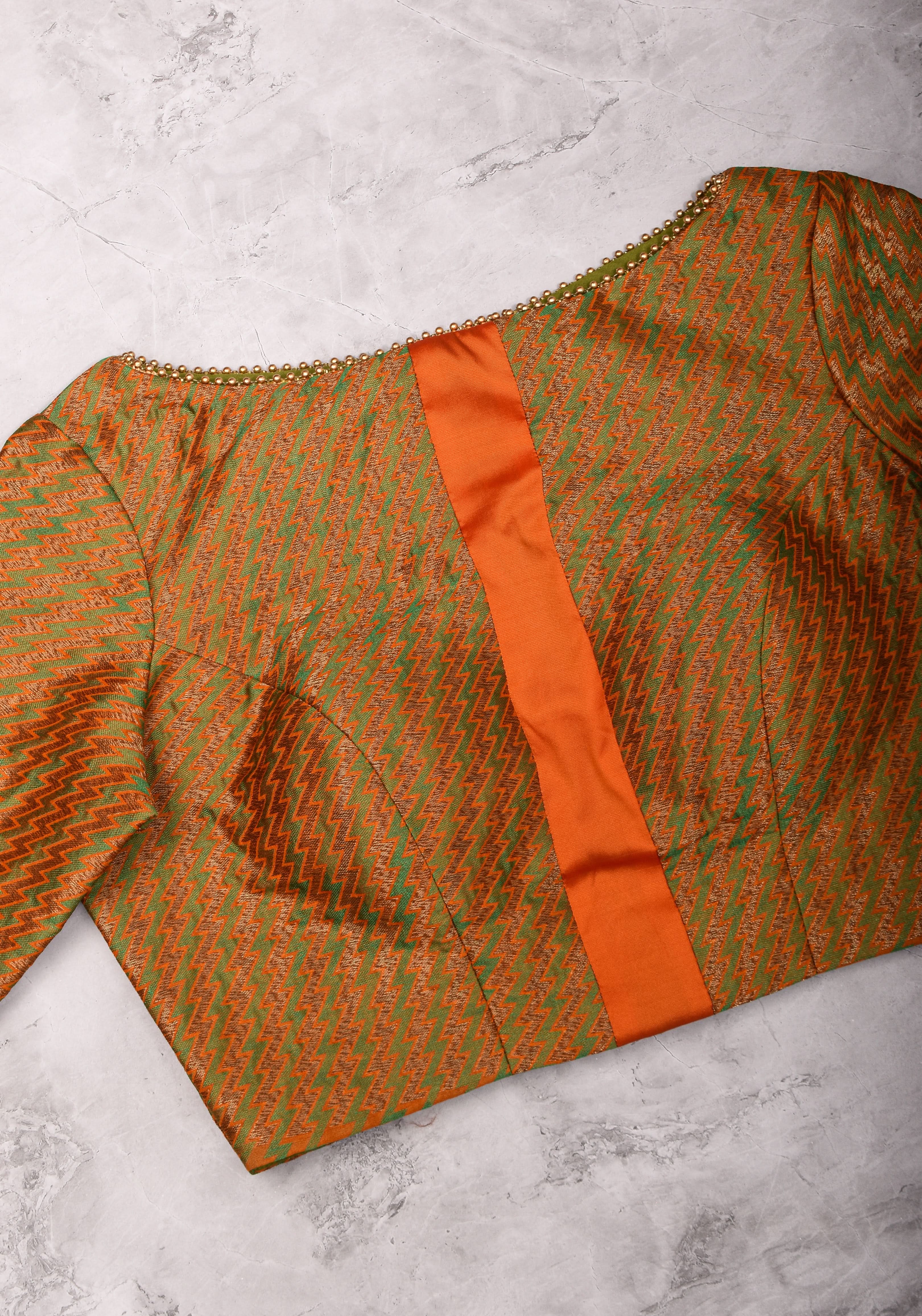 Henna Green and orange Jacquard boatneck blouse with plain silk detailing, Made to Order | Shobitam