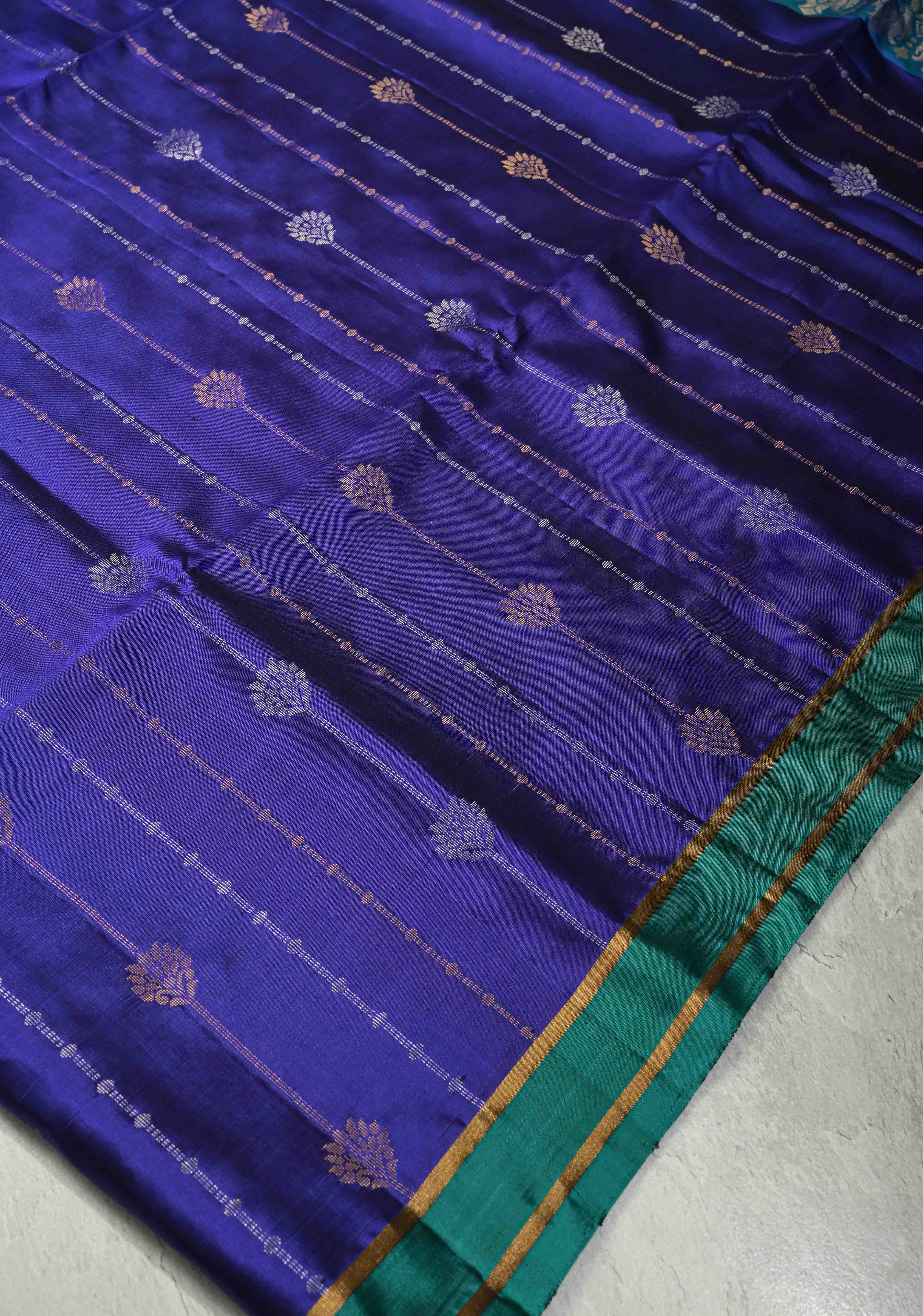 Deep Ink Blue Dual Tone Pure Kanjivaram Soft Silk Saree with Gold-Silver Zari Stripes and Contrast Rama Green Minimal Zari Border | SILK MARK CERTIFIED | Shobitam