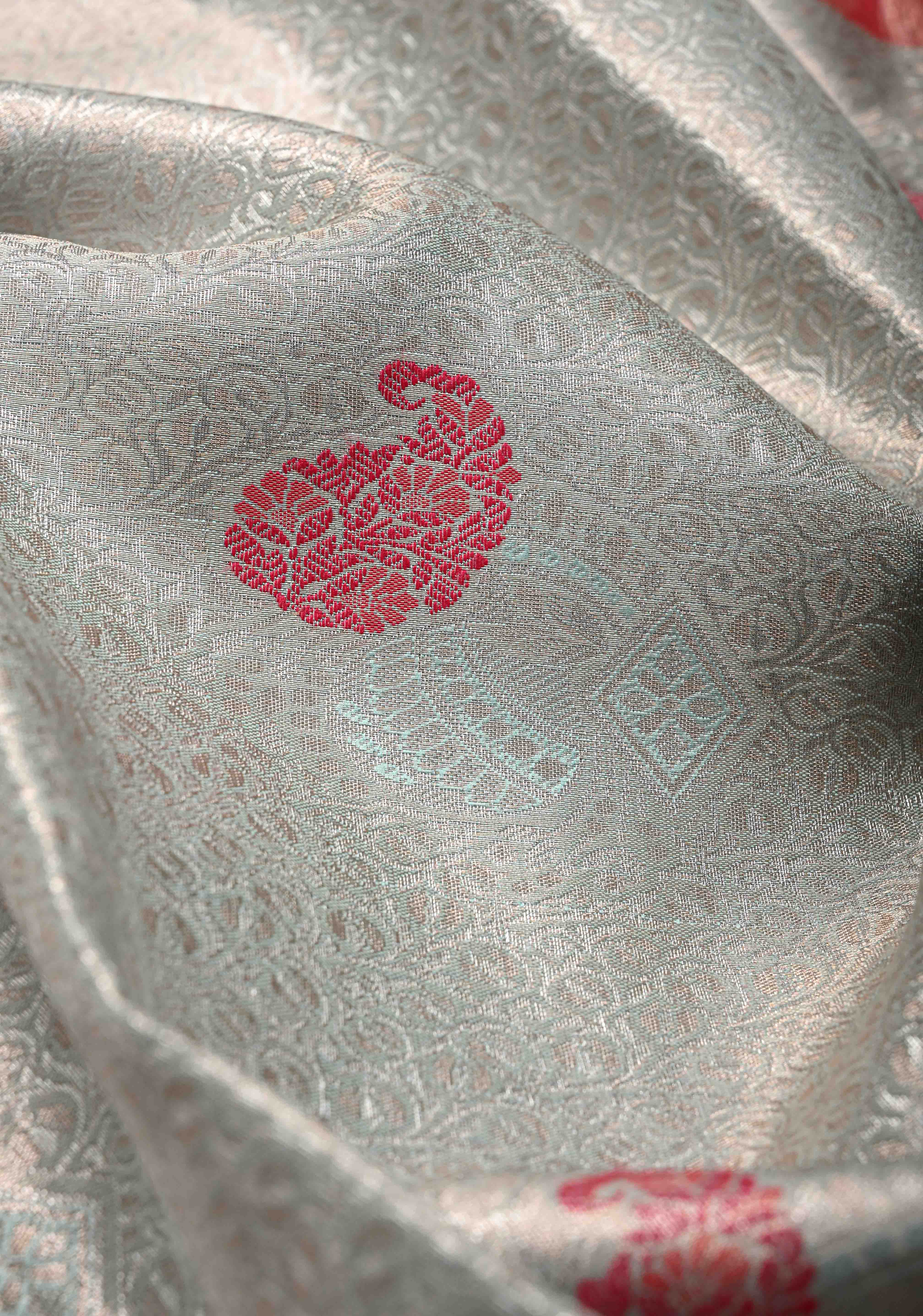 Light Sage Green Brocade on Kanjivaram Tissue Semi Silk Saree with Meenakari Buttas and Contrast Zari Border | Shobitam