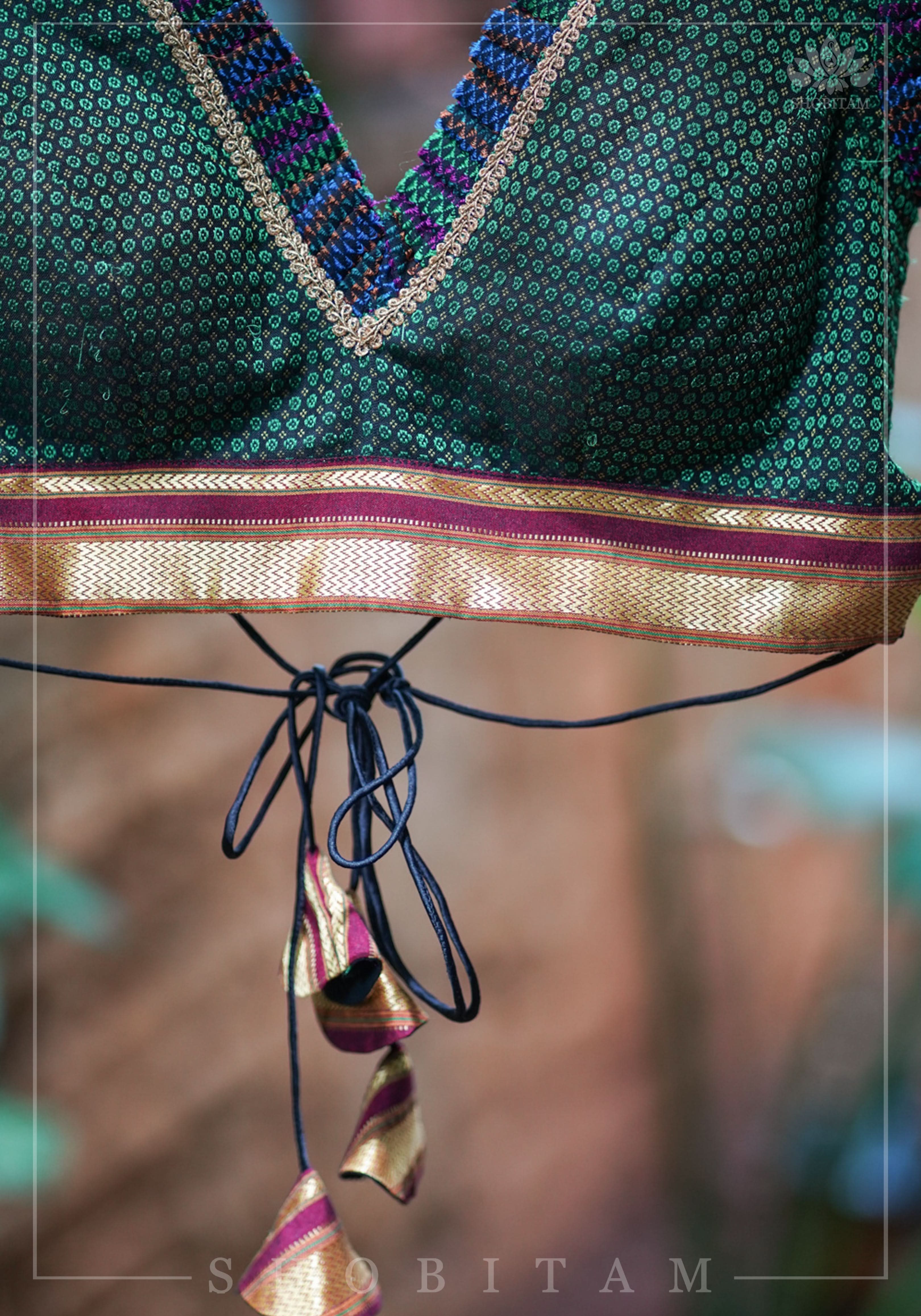 Dark green & black khana silk V neck blouse with frill detailing and backless design< made to order | Shobitam