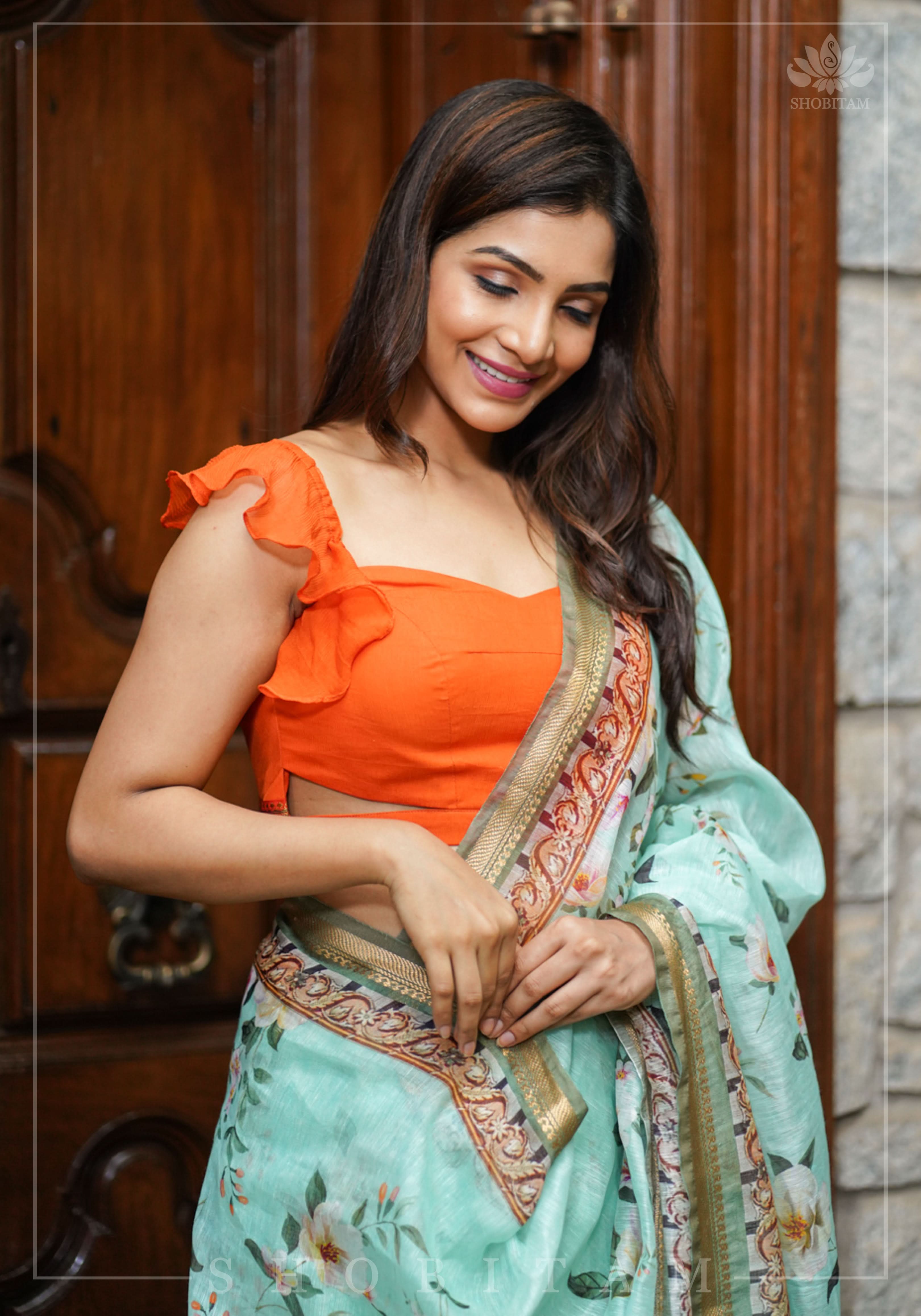 Orange chiffon sweetheart neck blouse with ruffle sleeves | Shobitam