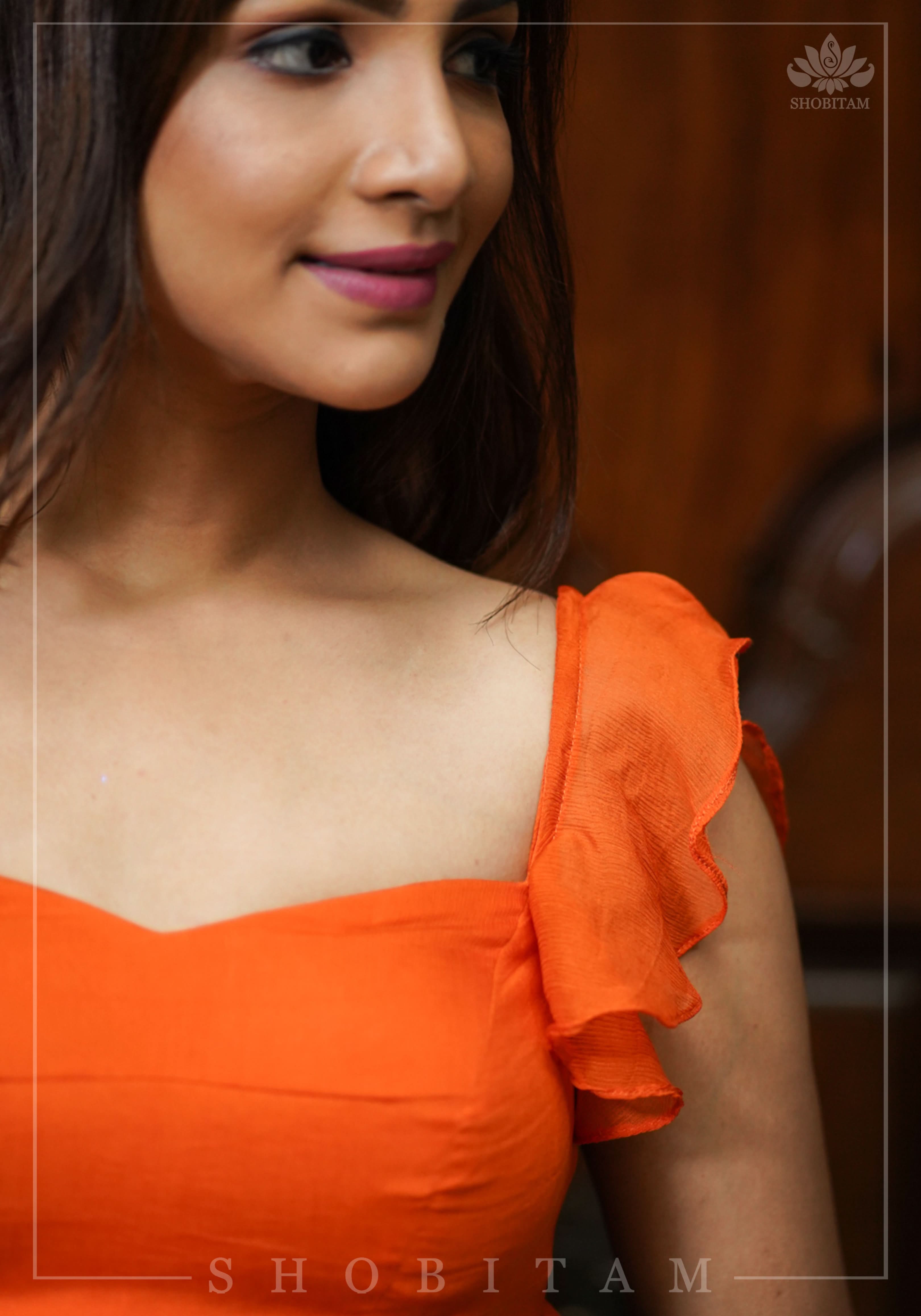 Orange chiffon sweetheart neck blouse with ruffle sleeves | Shobitam