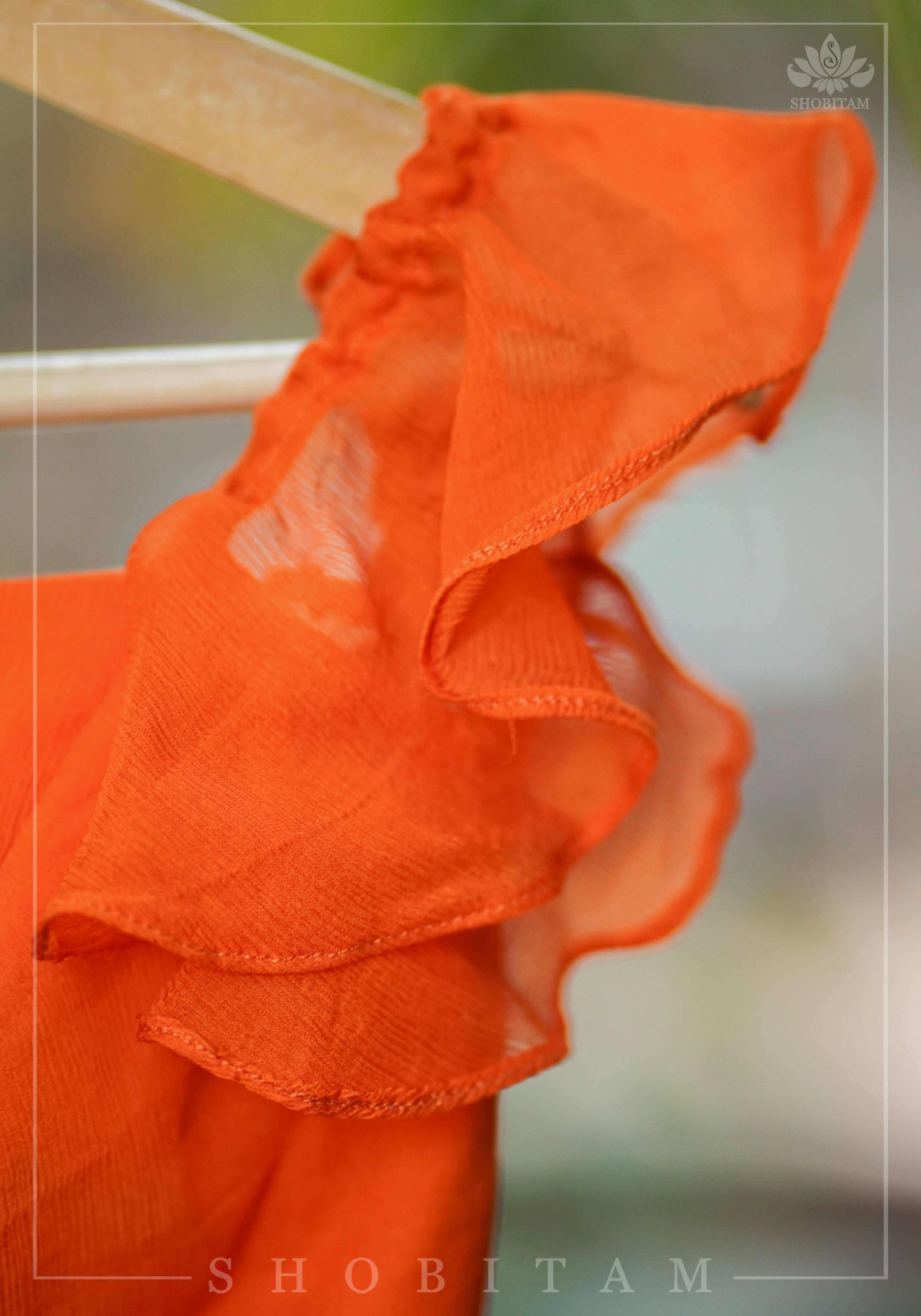 Orange chiffon sweetheart neck blouse with ruffle sleeves | Shobitam